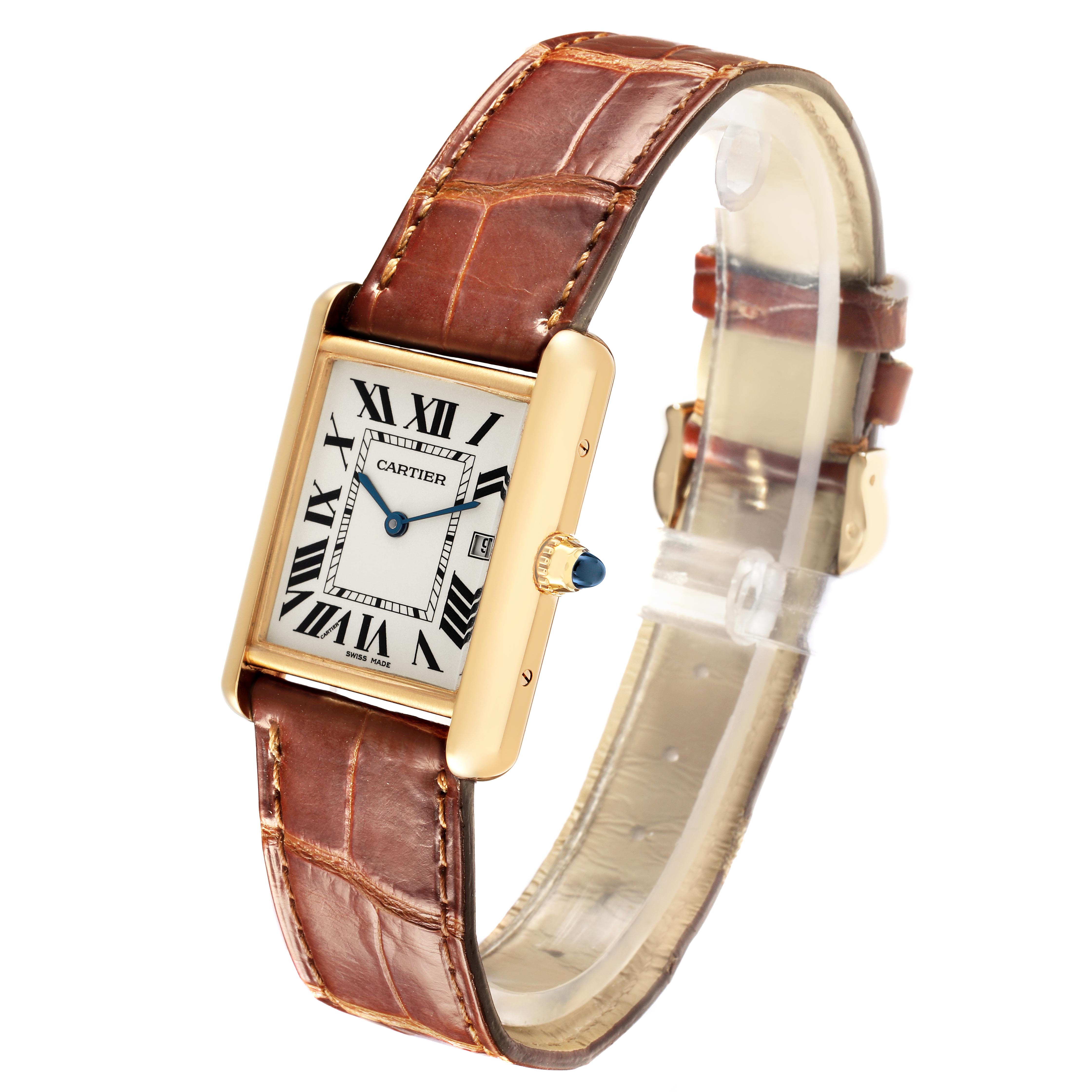 The Cartier Tank Louis W1529756 Men's Yellow Gold Silver Dial W1529756 Men's Yellow Gold Silver Dial watch is shown in a three-quarter view, highlighting its gold case, leather strap, and blue cabochon crown.