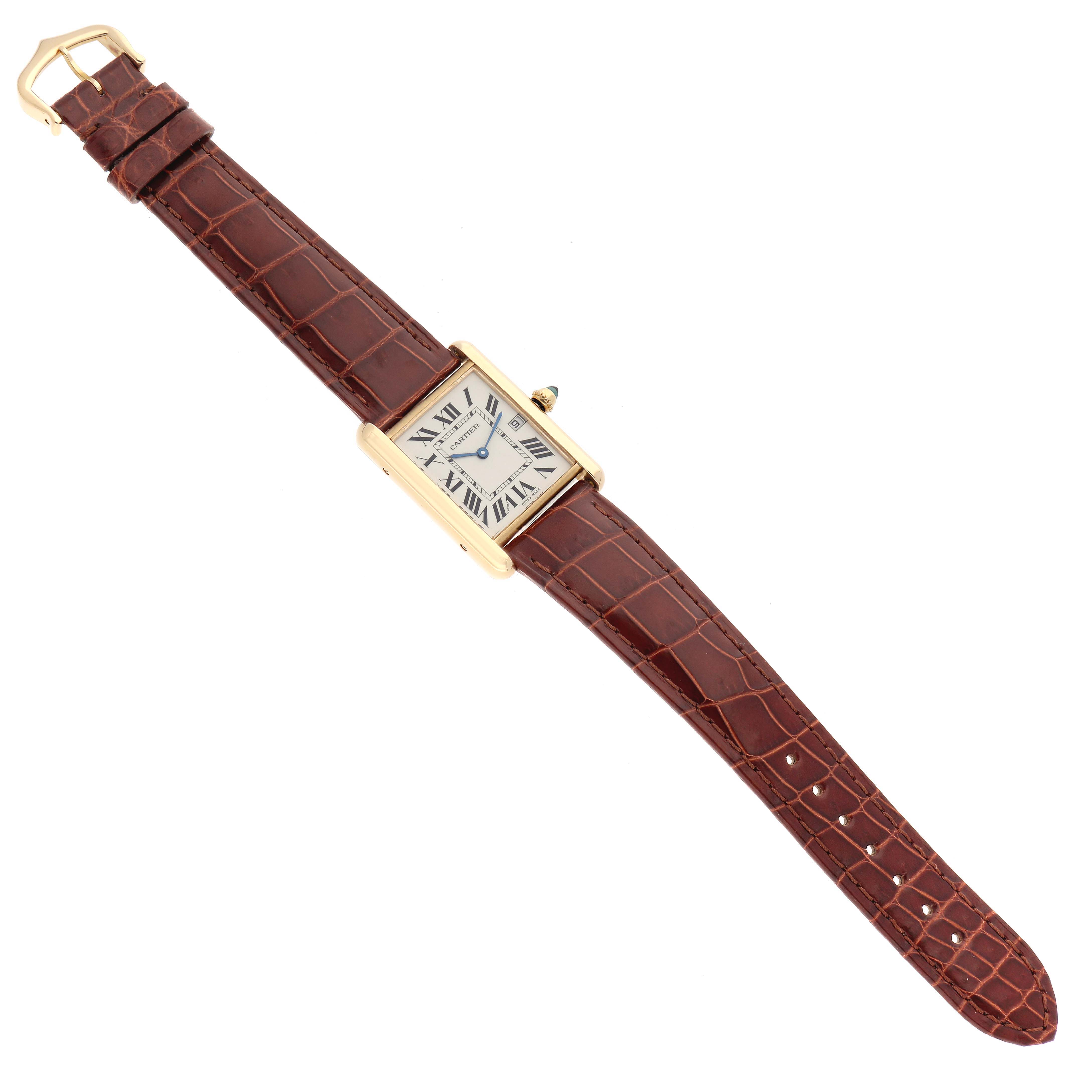 The Cartier Tank Louis W1529756 Men's Yellow Gold Silver Dial W1529756 Men's Yellow Gold Silver Dial watch is shown from a top-down angle, displaying its face, case, crown, and leather strap.