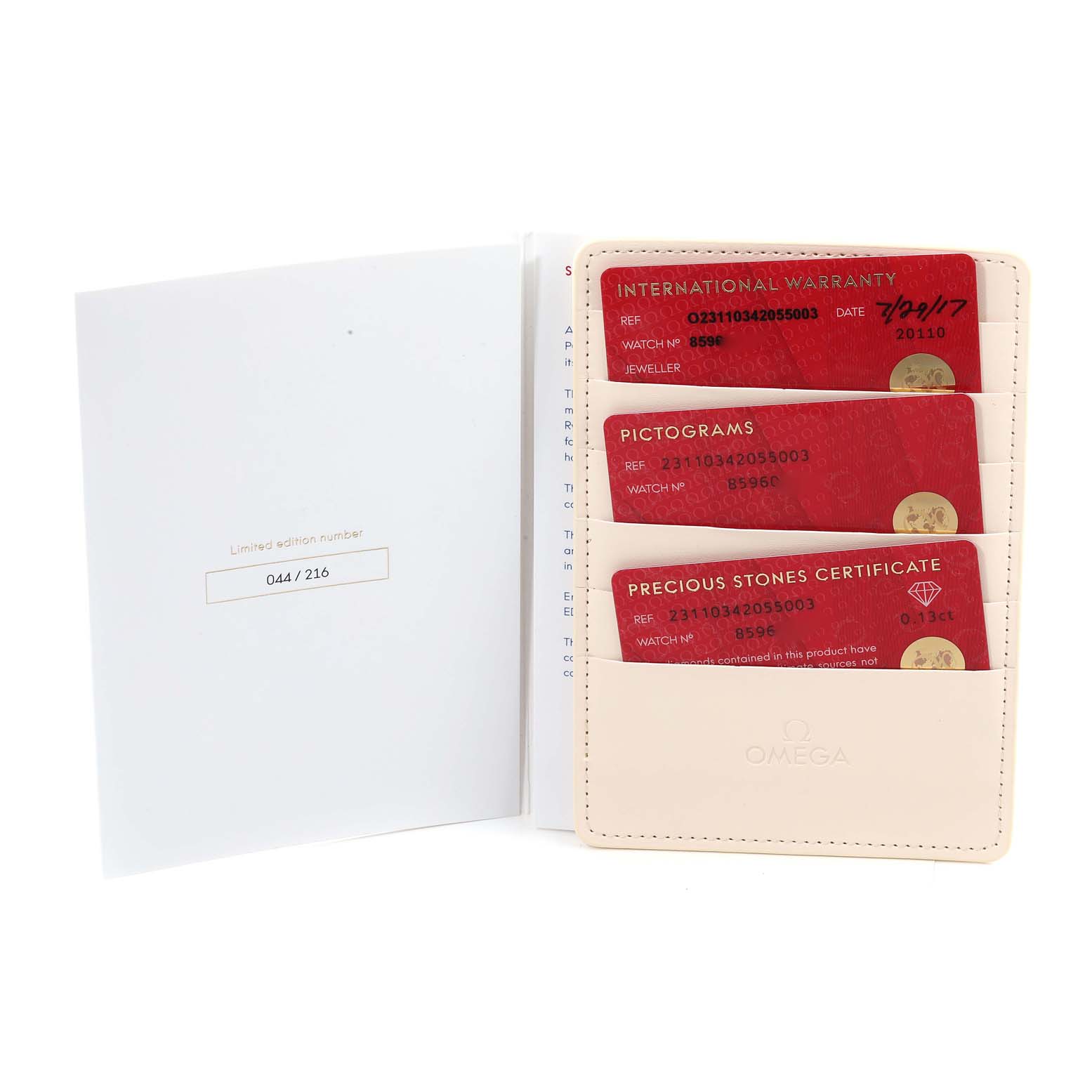 This image shows the warranty cards and certificates for the Omega 231.10.34.20.55.003 Women's Stainless Steel Mother of Pearl Dial 231.10.34.20.55.003 Women's Stainless Steel Mother of Pearl Dial Aqua Terra Ryder Cup Mother Of Pearl Diamond Ladies Watch 231.10.34.20.55.003.