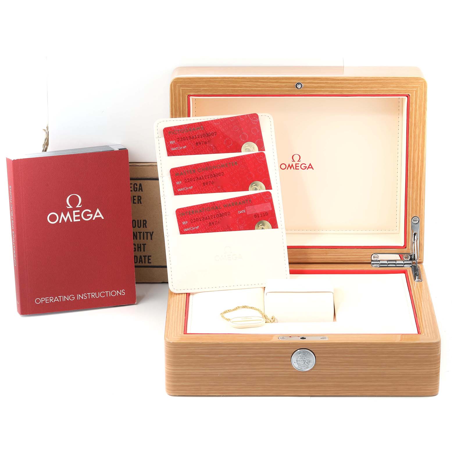 The image shows an open Omega Aqua Terra 220.13.41.21.03.002 Men
s Stainless Steel Blue Dial 220.13.41.21.03.002 Men
s Stainless Steel Blue Dial watch box, red operating instructions, and warranty cards.