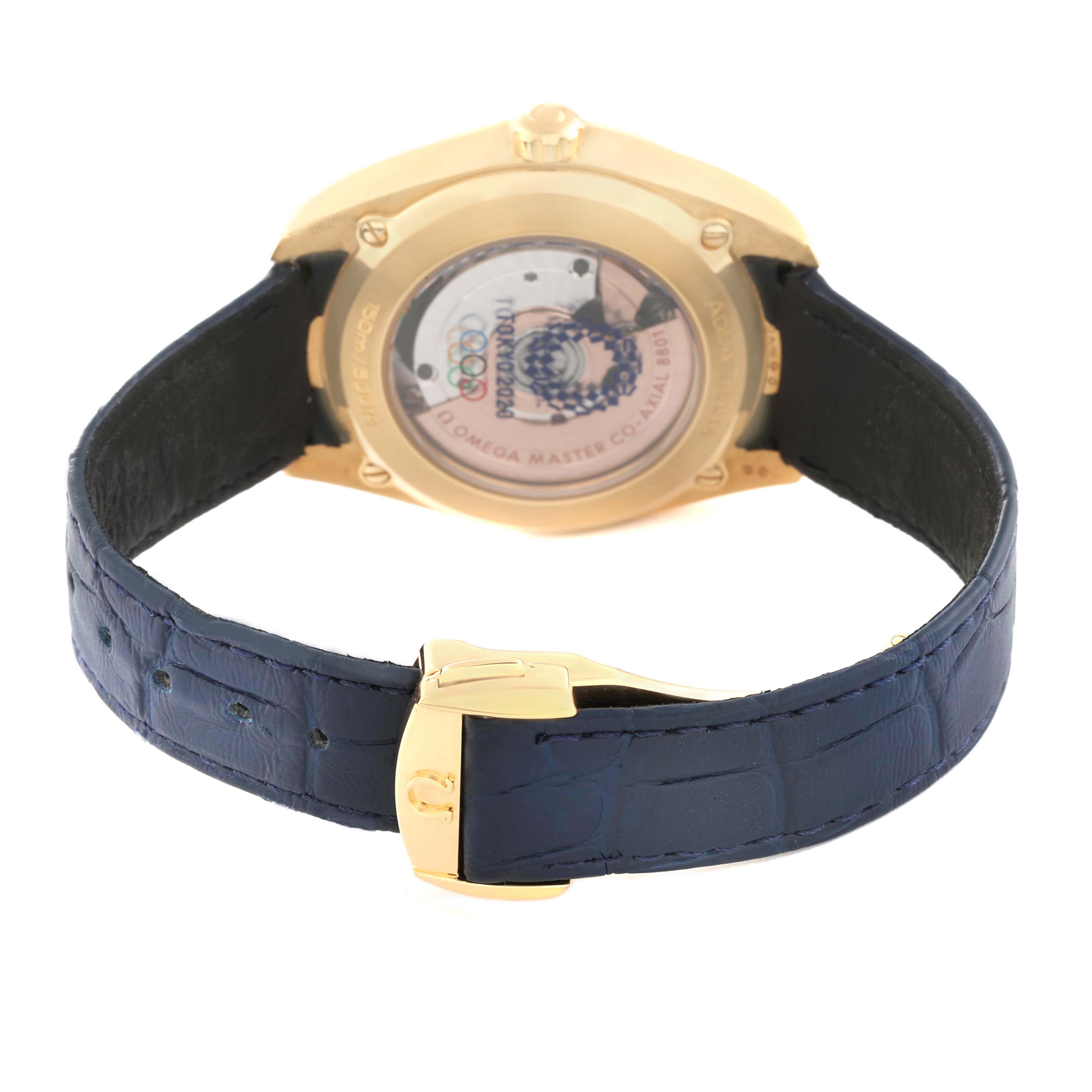 The Omega Aqua Terra 522.53.38.20.03.001 Men's Yellow Gold Blue Dial watch is shown from the back, highlighting the case back, movement, and blue leather strap with a clasp.