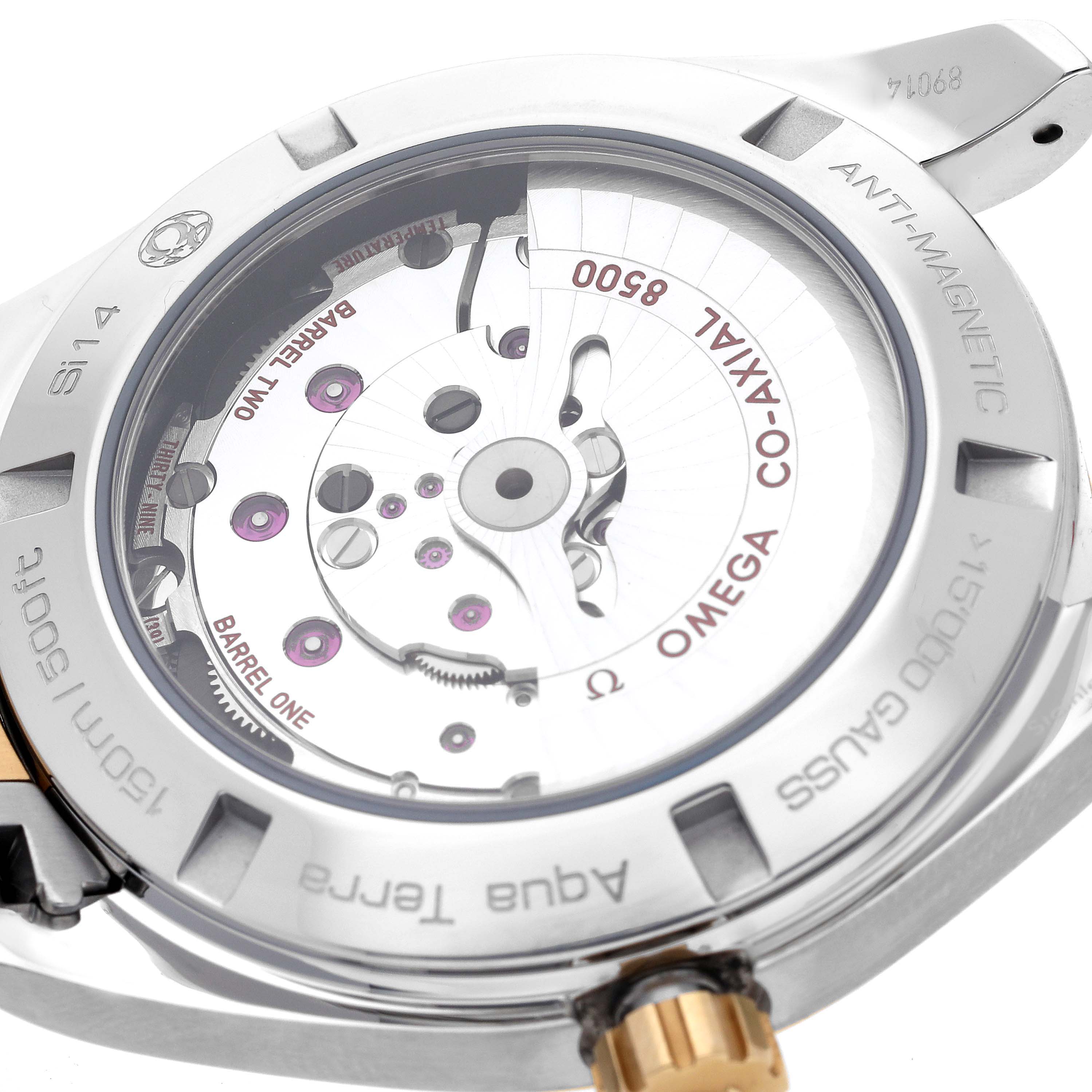 The image shows the back view of the Omega Aqua Terra 231.20.42.21.08.001 Men's Steel and Gold (two tone) Champagne Dial 231.20.42.21.08.001 Men's Steel and Gold (two tone) Champagne Dial watch, highlighting the co-axial movement and antimagnetic features.