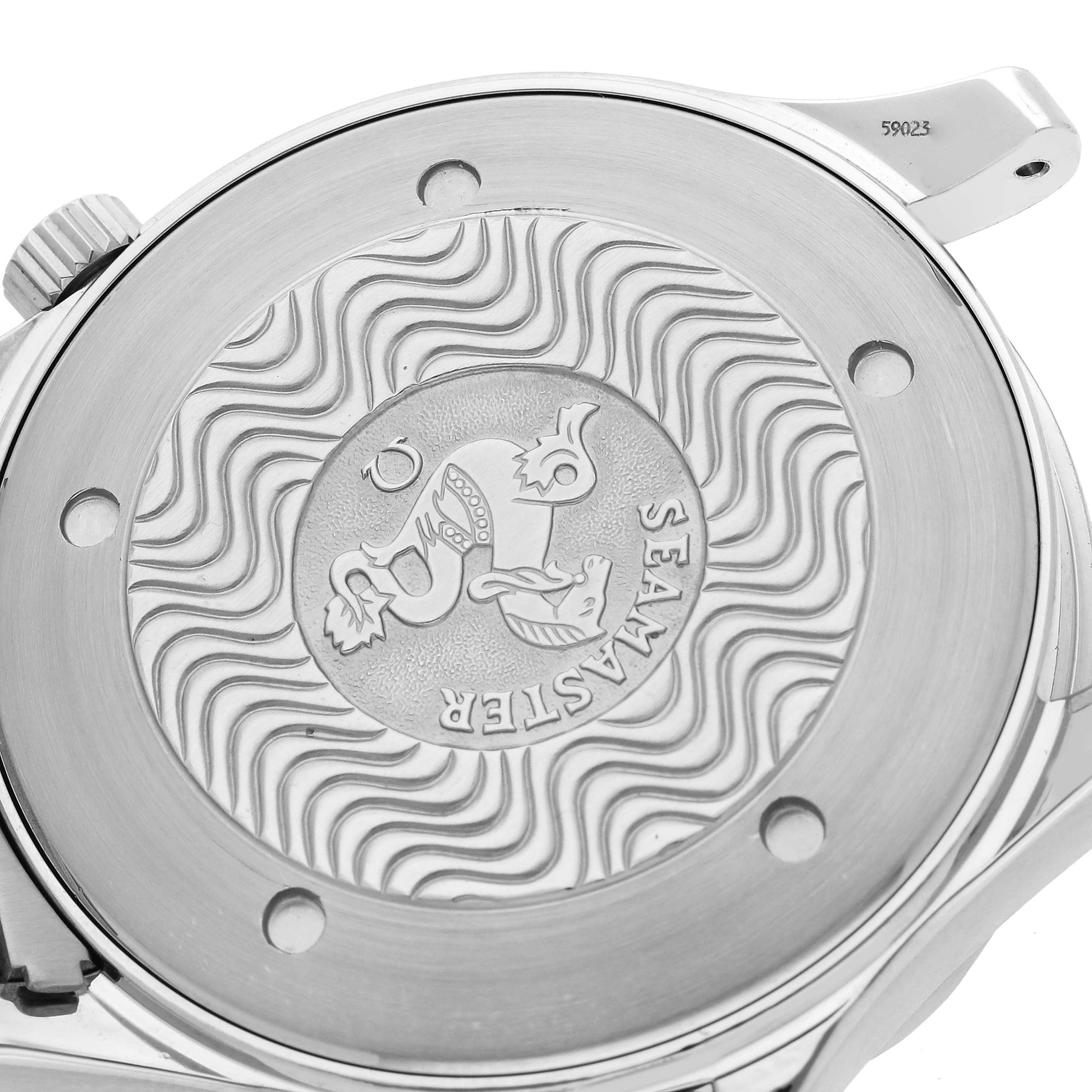 The image shows the back case of an Omega Seamaster 2541.80.00 Men's Stainless Steel Blue Dial 2541.80.00 Men's Stainless Steel Blue Dial watch, highlighting the engraved logo and wave pattern.