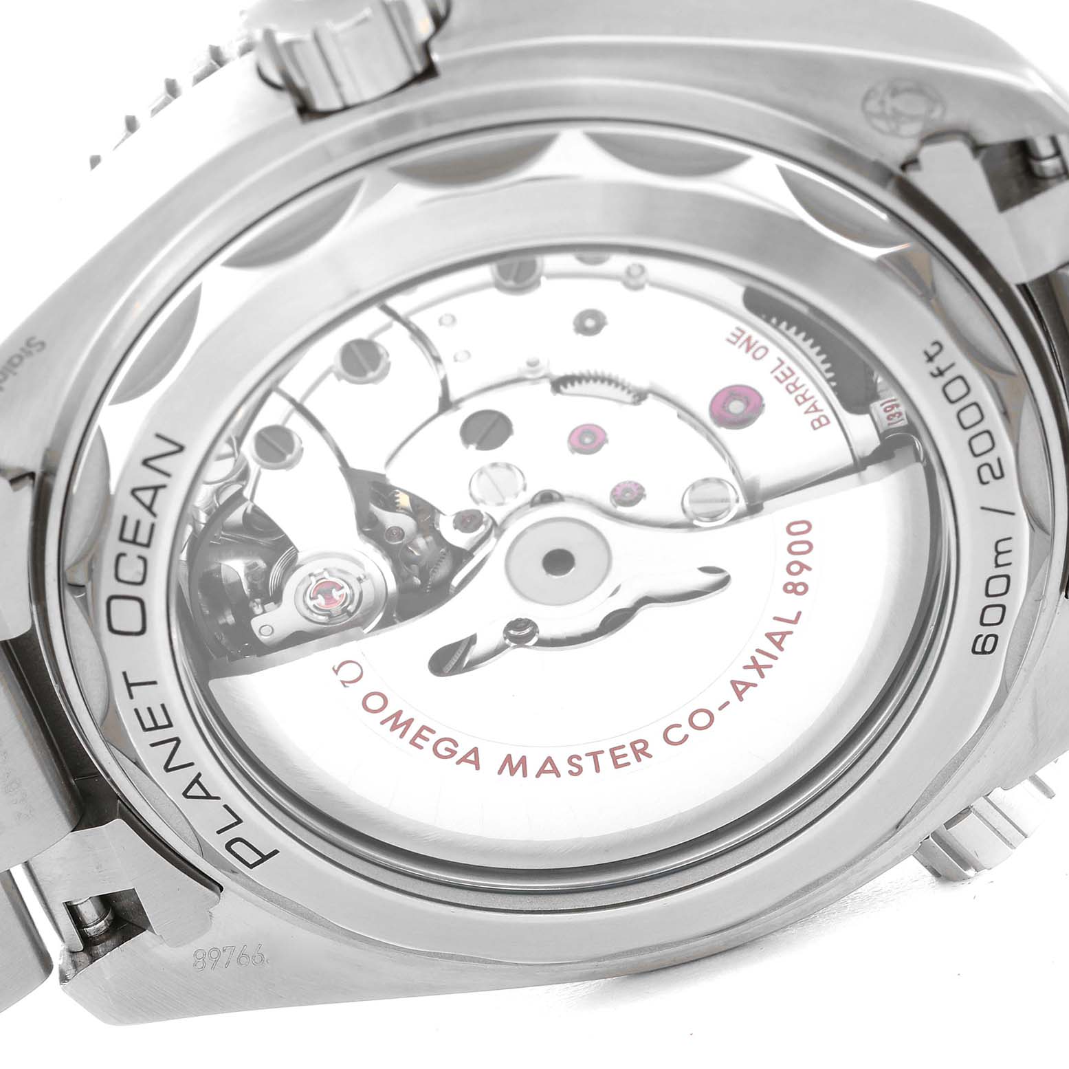 The image shows the back of an Omega Planet Ocean 215.30.44.21.01.001 Men
s Stainless Steel Black Dial 215.30.44.21.01.001 Men
s Stainless Steel Black Dial watch, highlighting the intricate mechanics and movement inside.