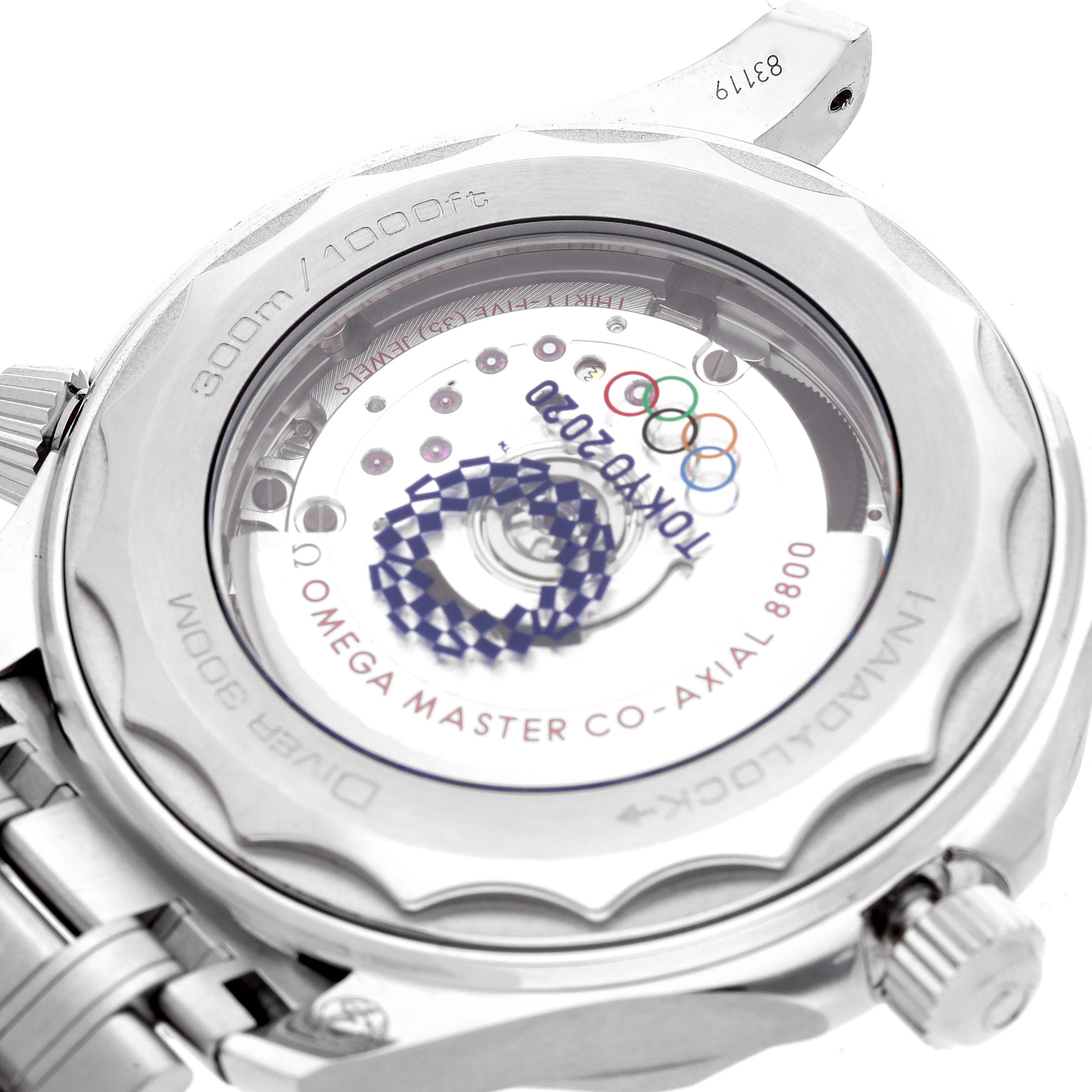 This image shows the back case of the Omega Seamaster 522.30.42.20.04.001 Men's Stainless Steel White Dial 522.30.42.20.04.001 Men's Stainless Steel White Dial watch, highlighting the co-axial 8800 movement and "Tokyo 2020" engravings.