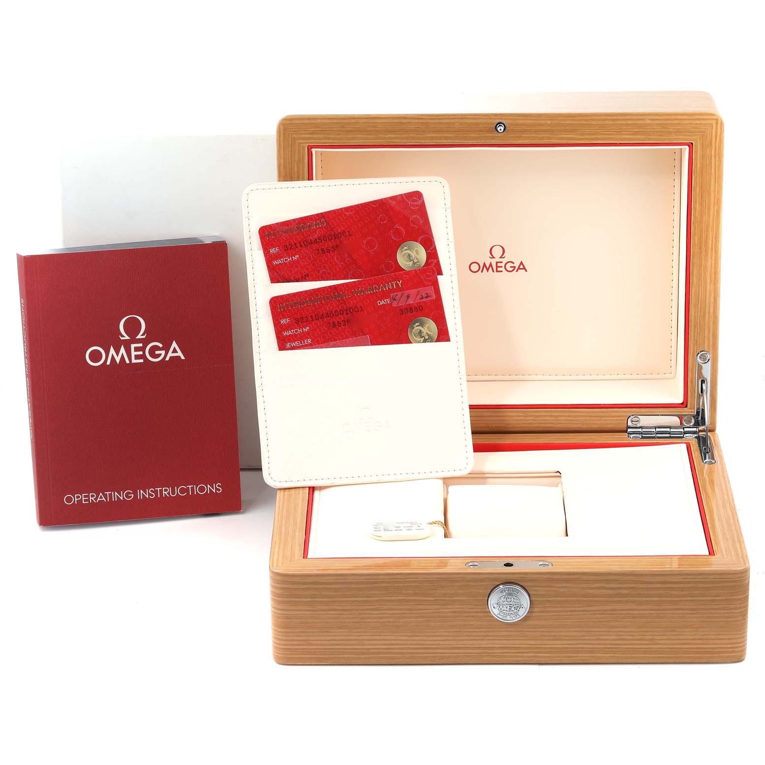 The image shows an Omega Speedmaster 321.10.44.50.01.001 Men's Stainless Steel Black Dial 321.10.44.50.01.001 Men's Stainless Steel Black Dial watch box set with warranty cards, an instruction manual, and an empty inner pillow.