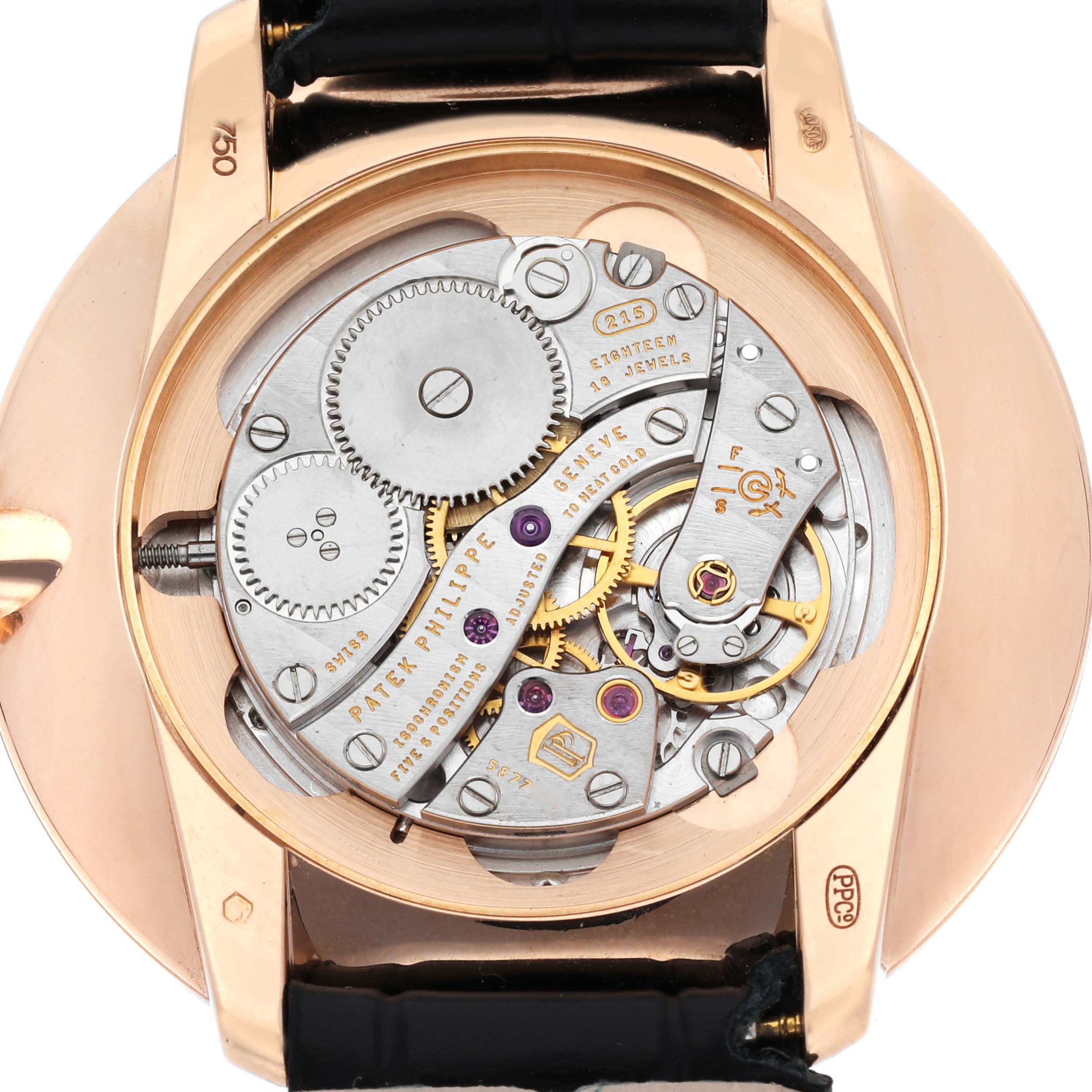 The image shows the back of a Patek Philippe Calatrava 5123R-001 Men
s Rose Gold Silver Dial 5123R-001 Men
s Rose Gold Silver Dial, highlighting its intricate movement and mechanism.