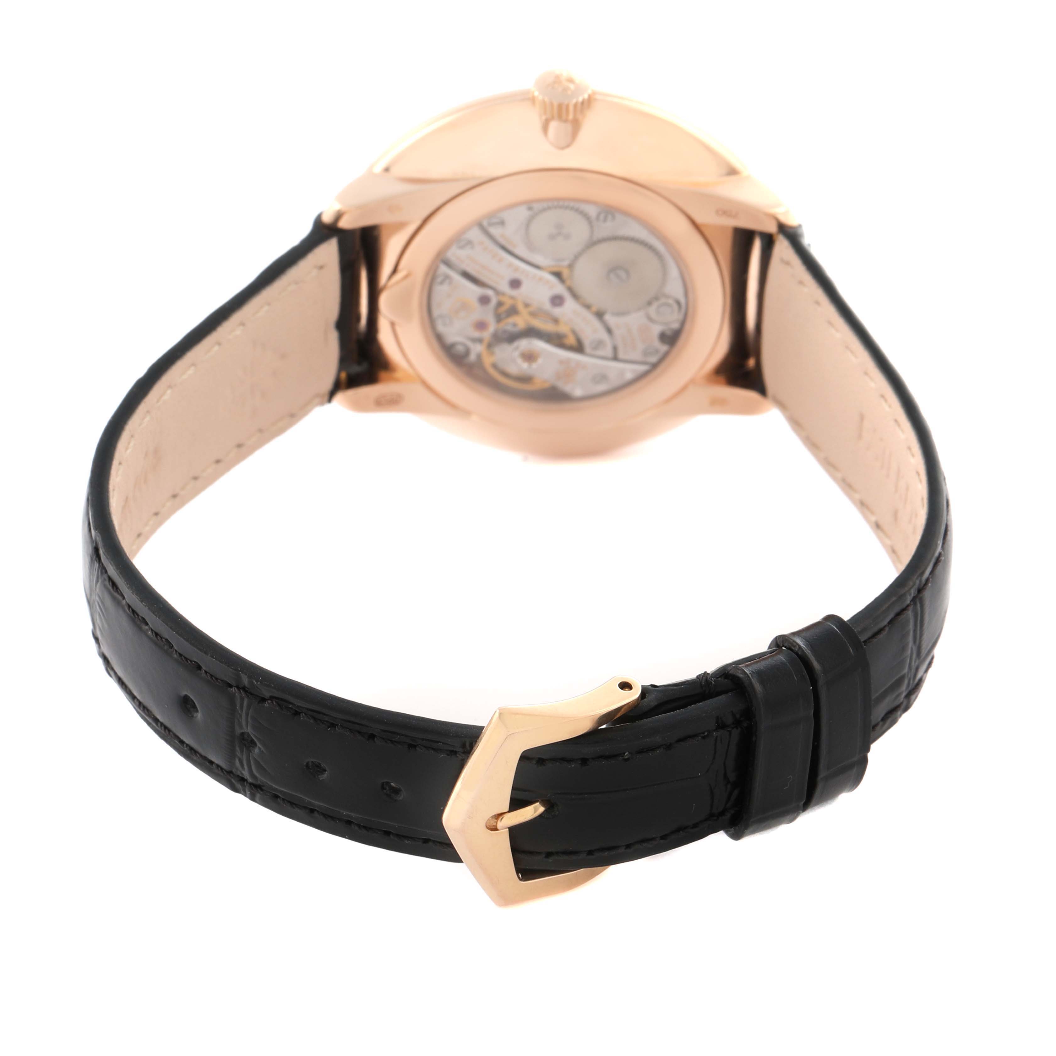 The Patek Philippe Calatrava 5123R-001 Men
s Rose Gold Silver Dial 5123R-001 Men
s Rose Gold Silver Dial watch is shown from the back, highlighting the movement and black leather strap with a gold buckle.