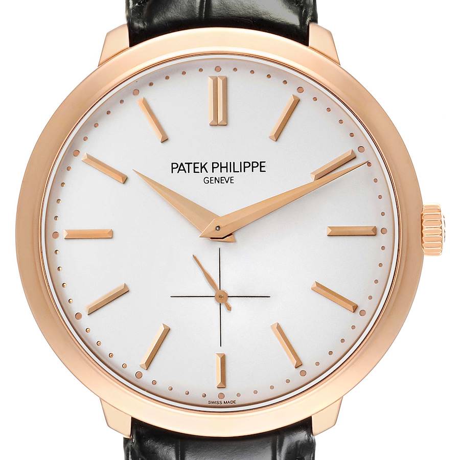 The Patek Philippe Calatrava watch is shown from a front view, highlighting the dial, hands, and leather strap.