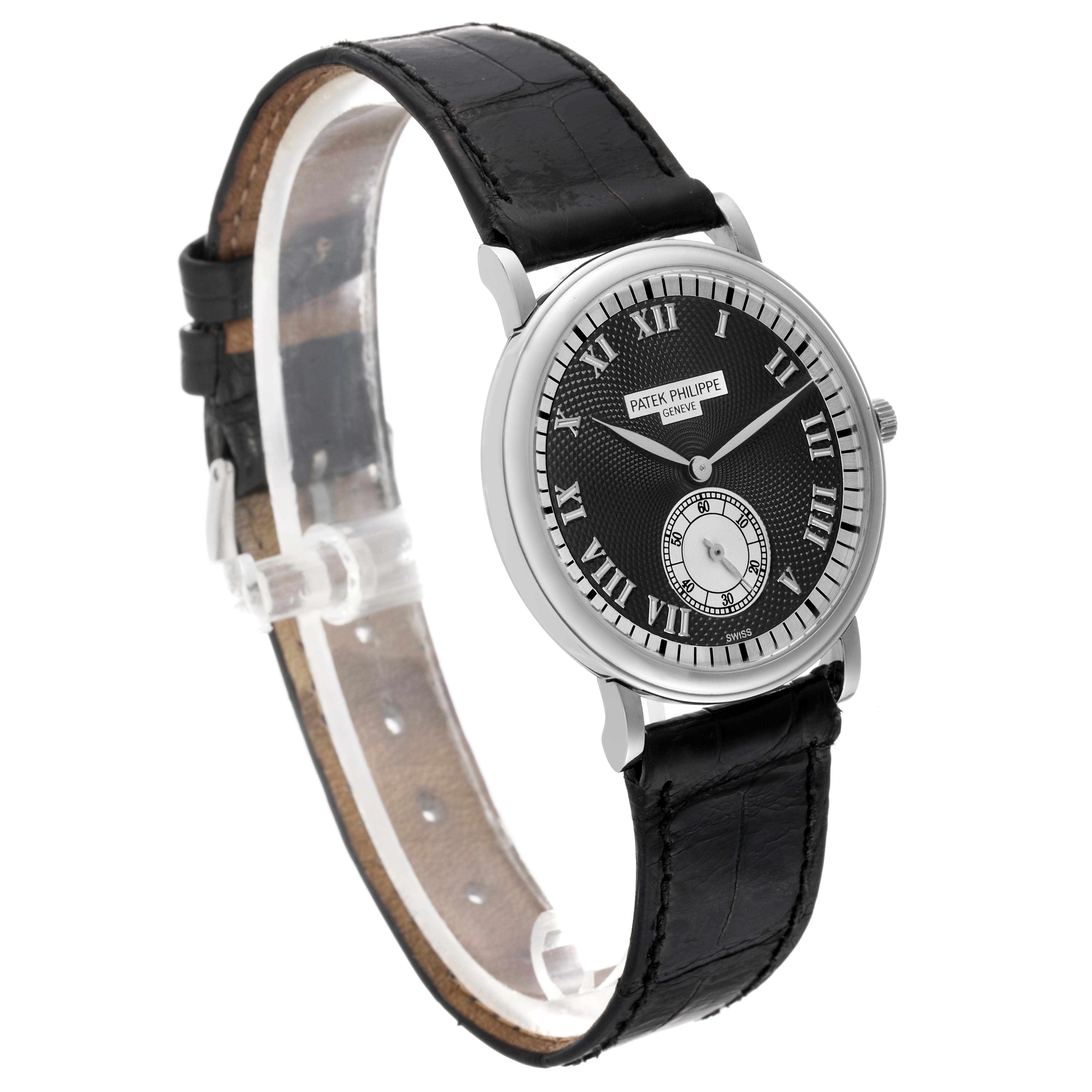 The image shows a side angle view of a Patek Philippe Calatrava 5022G Men's White Gold Black Dial 5022G Men's White Gold Black Dial watch, highlighting its face and black leather strap.