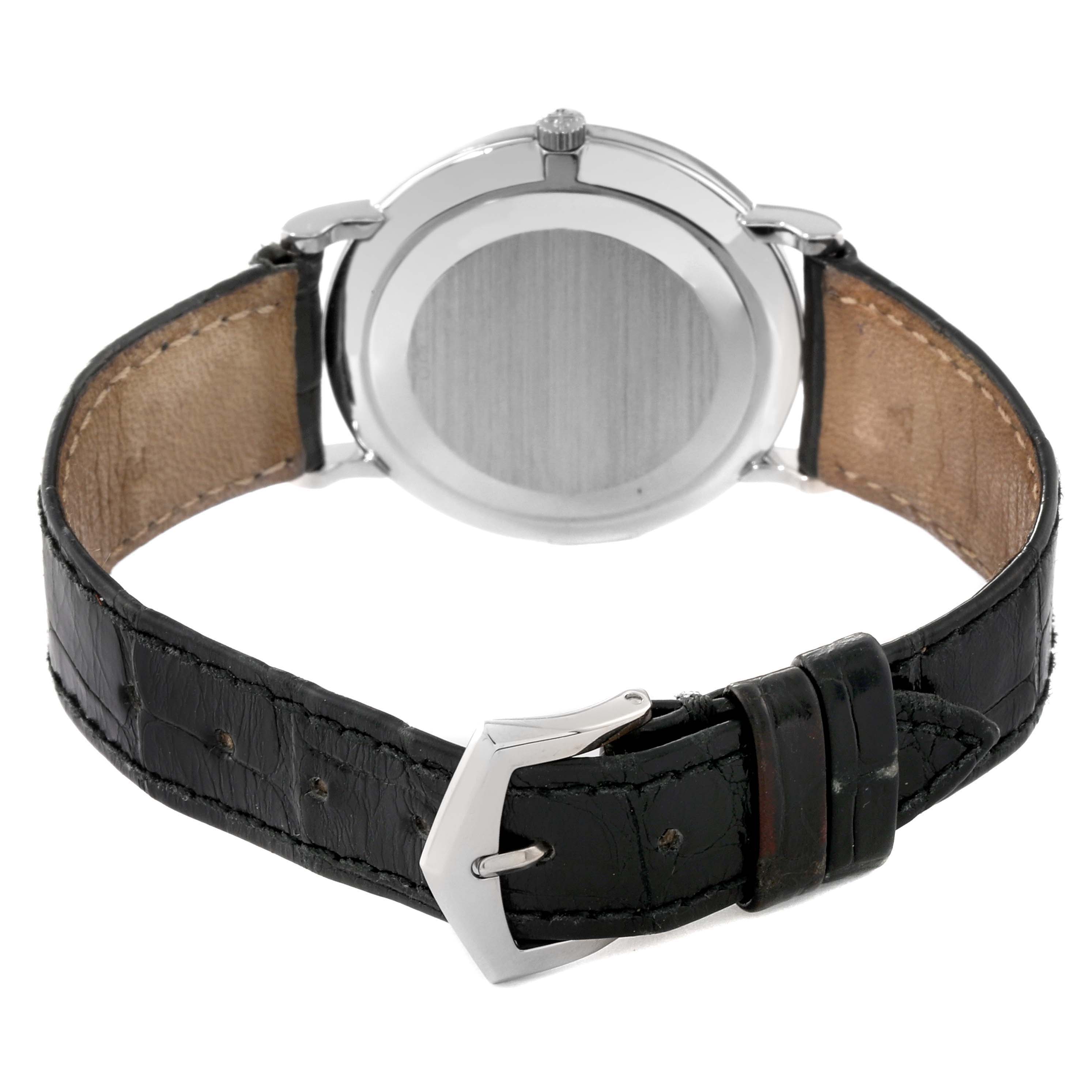 The image shows the back view of a Calatrava model by Patek Philippe with its leather strap and buckle.