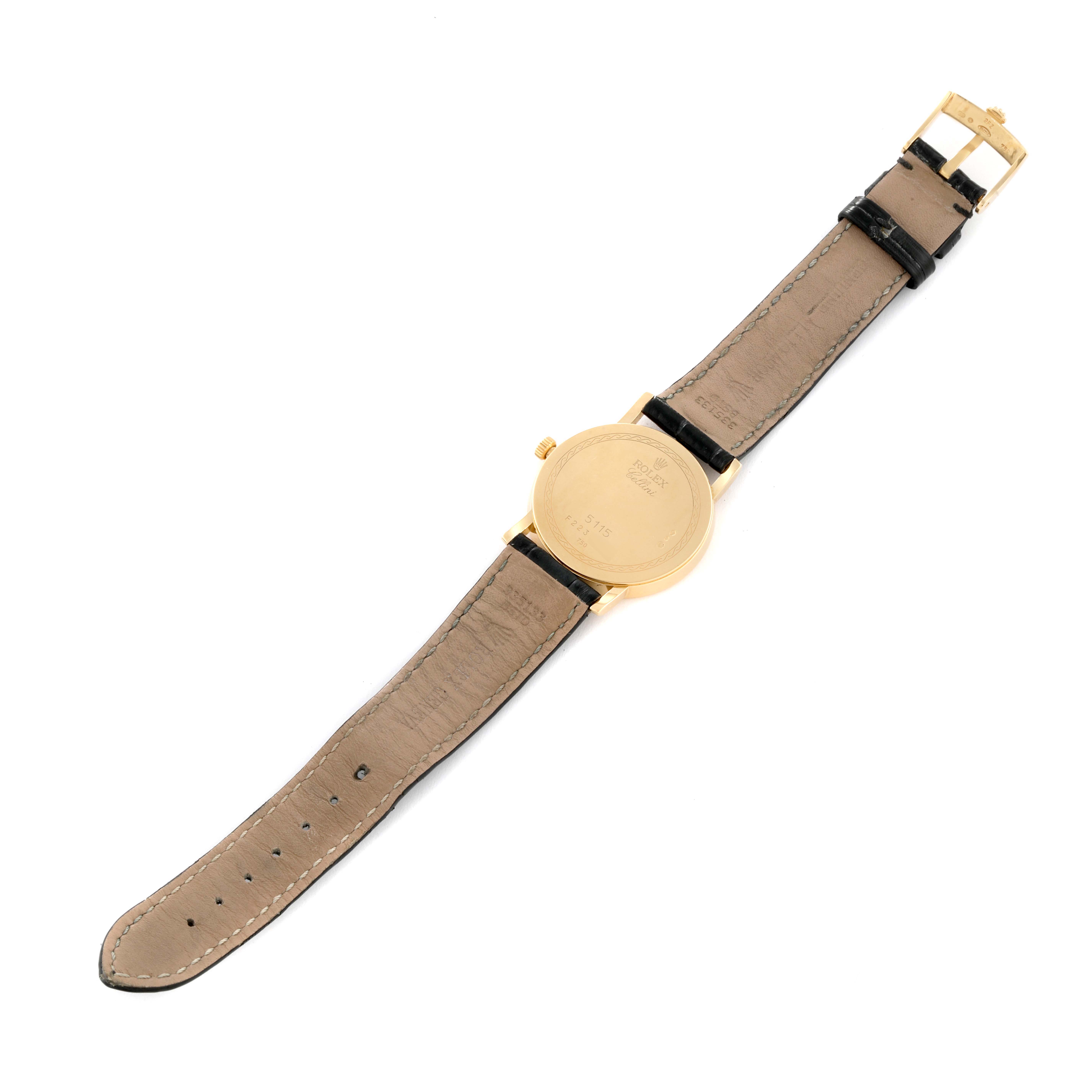 This image shows the back view of a Rolex Cellini 5115 Men's Yellow Gold White Dial 5115 Men's Yellow Gold White Dial watch, highlighting the case back, crown, and leather strap with buckle.