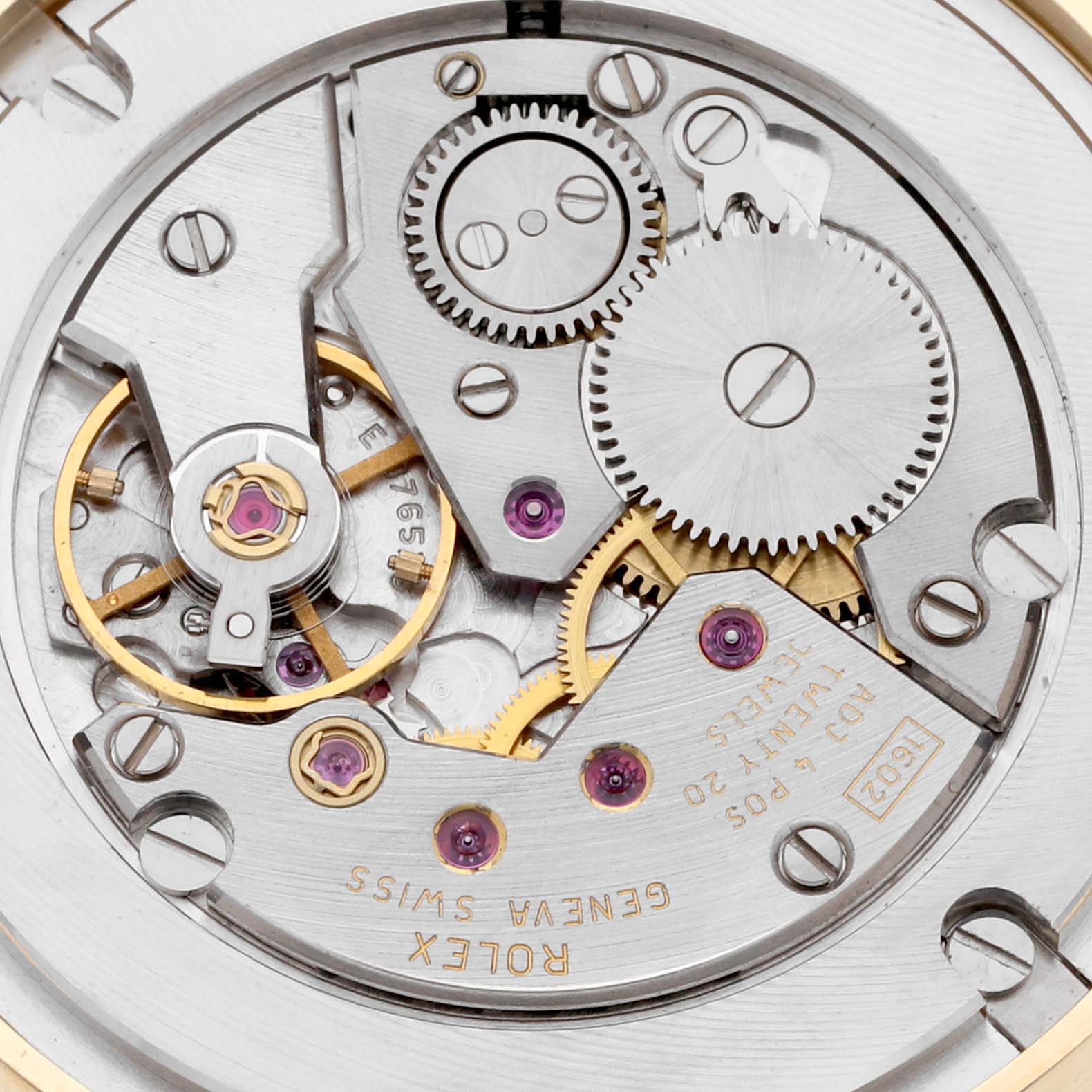This image shows the internal mechanical movement and gears of a Rolex Cellini 5115 Men's Yellow Gold White Dial 5115 Men's Yellow Gold White Dial watch from a close-up angle.