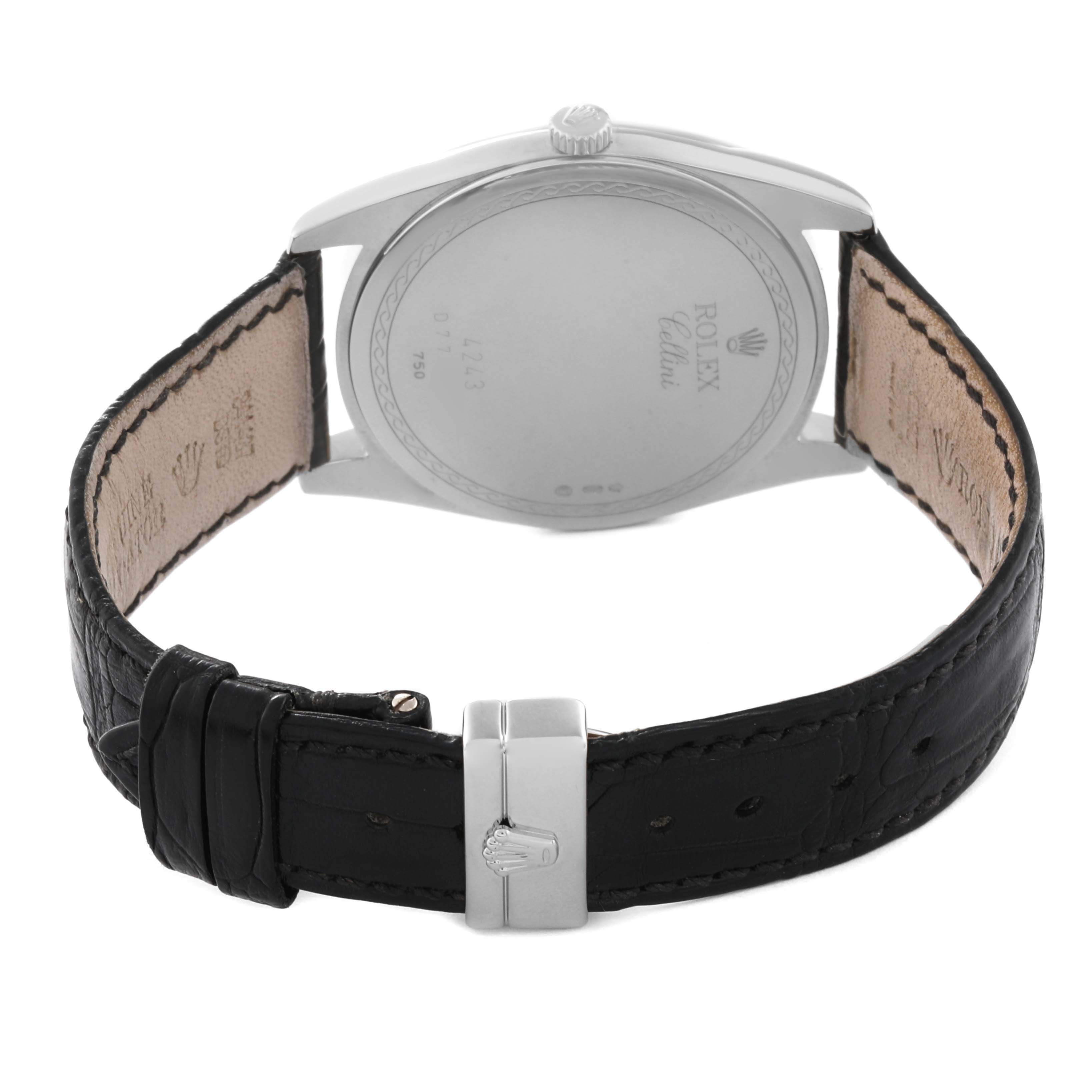The image shows the back view of a Rolex Cellini 4243 Men's White Gold Black Dial 4243 Men's White Gold Black Dial watch, highlighting its clasp, leather strap, and case back.