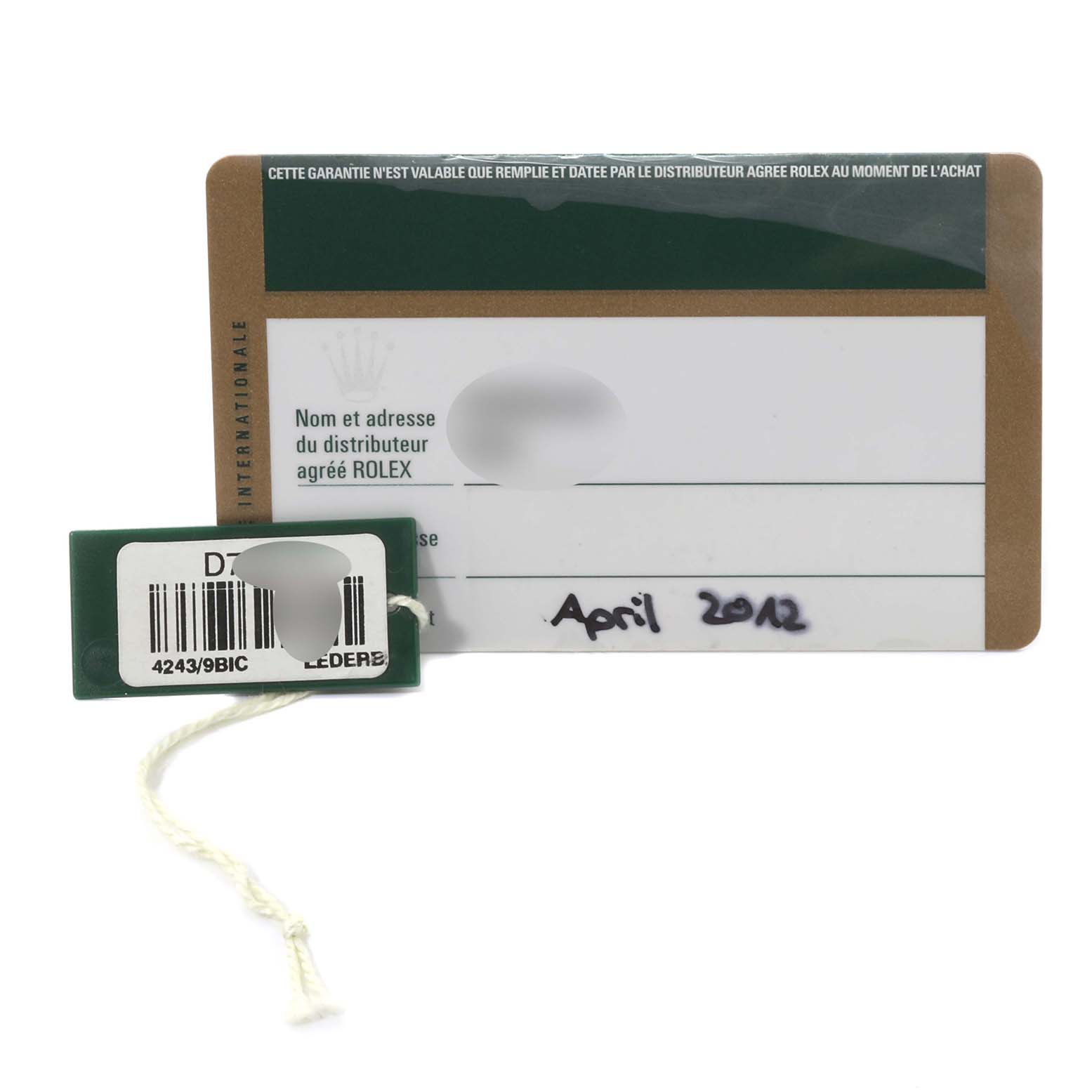 The image shows the warranty card and tag associated with the Rolex Cellini 4243 Men's White Gold Black Dial 4243 Men's White Gold Black Dial model.