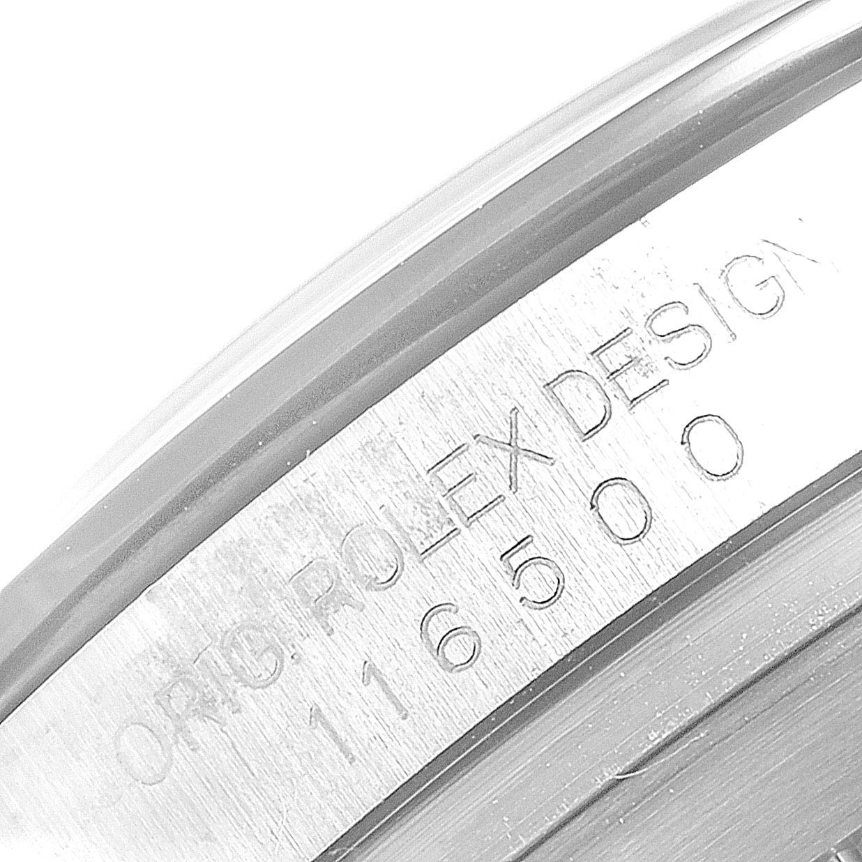 This close-up image shows the engraved bezel side of the Rolex Daytona 116500 Men's Stainless Steel Black Dial 116500 Men's Stainless Steel Black Dial, featuring the model number and brand design text.