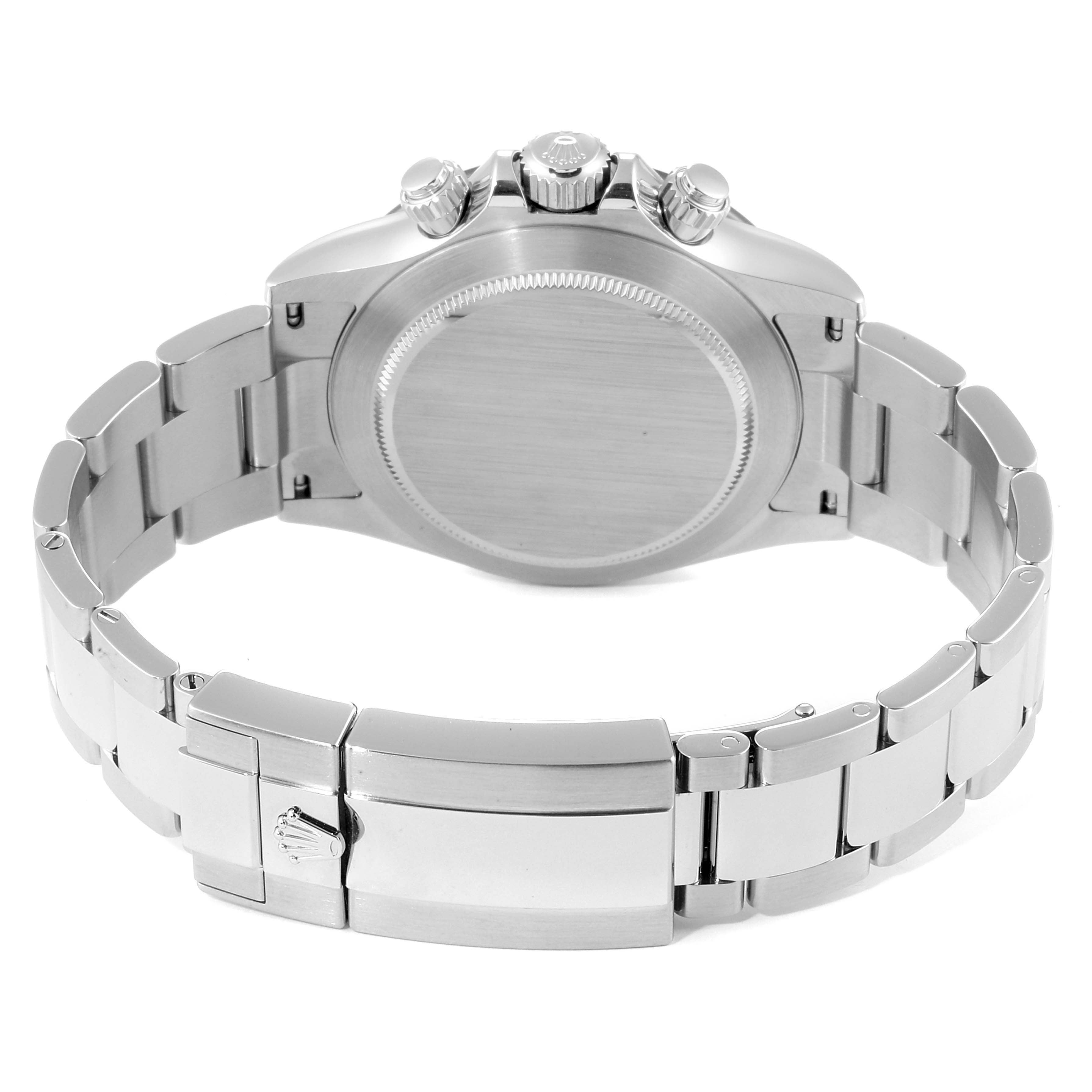 This image shows the back case, crown, and bracelet clasp of a Rolex Daytona 116500 Men's Stainless Steel Black Dial 116500 Men's Stainless Steel Black Dial watch.