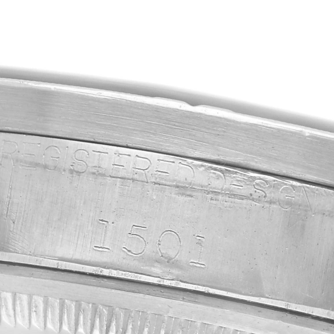 The image shows the side engraving on the case of a Rolex Date watch, displaying the model number "1501."