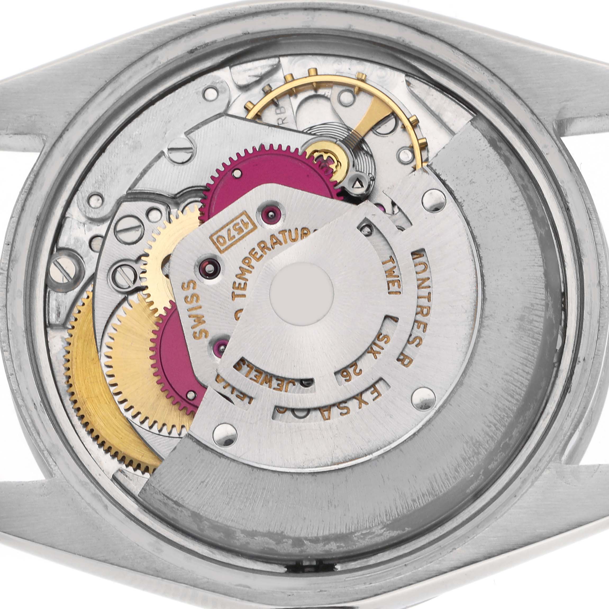 The image shows the movement of a Rolex Date watch from the back, highlighting gears and intricate components.
