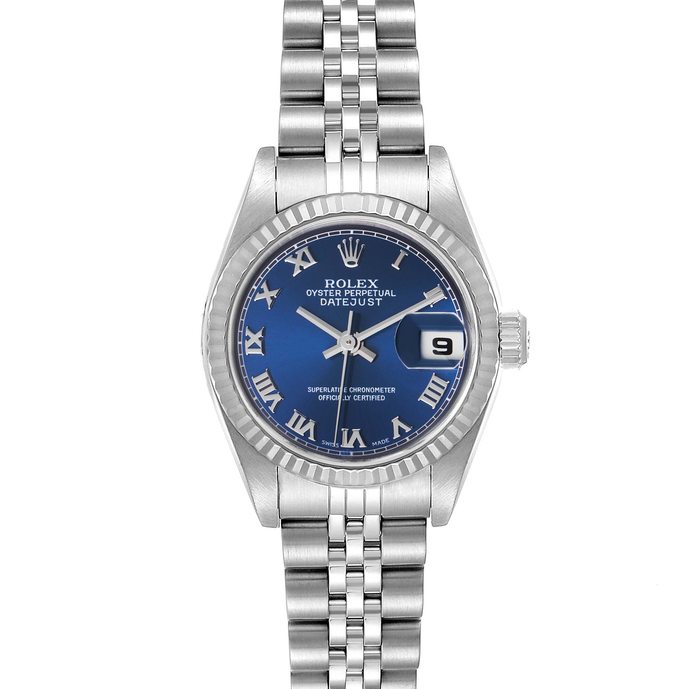 The Rolex Datejust 79174 Women
s Stainless Steel Blue Dial 79174 Women
s Stainless Steel Blue Dial watch is shown from a top-down angle, highlighting its blue dial, Roman numerals, and Jubilee bracelet.