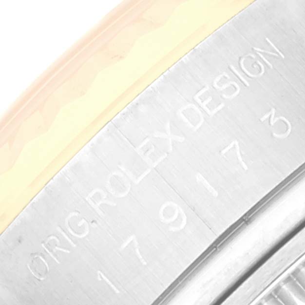 This image shows a close-up of the side with engravings on a Datejust model by Rolex.