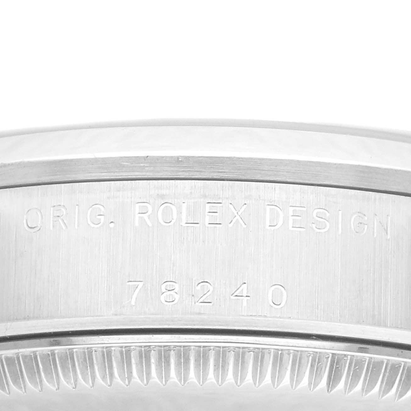 The image shows a close-up of the side case engraving of a Rolex Datejust 78240 Women's Stainless Steel Pink Dial 78240 Women's Stainless Steel Pink Dial, highlighting the serial and model number.