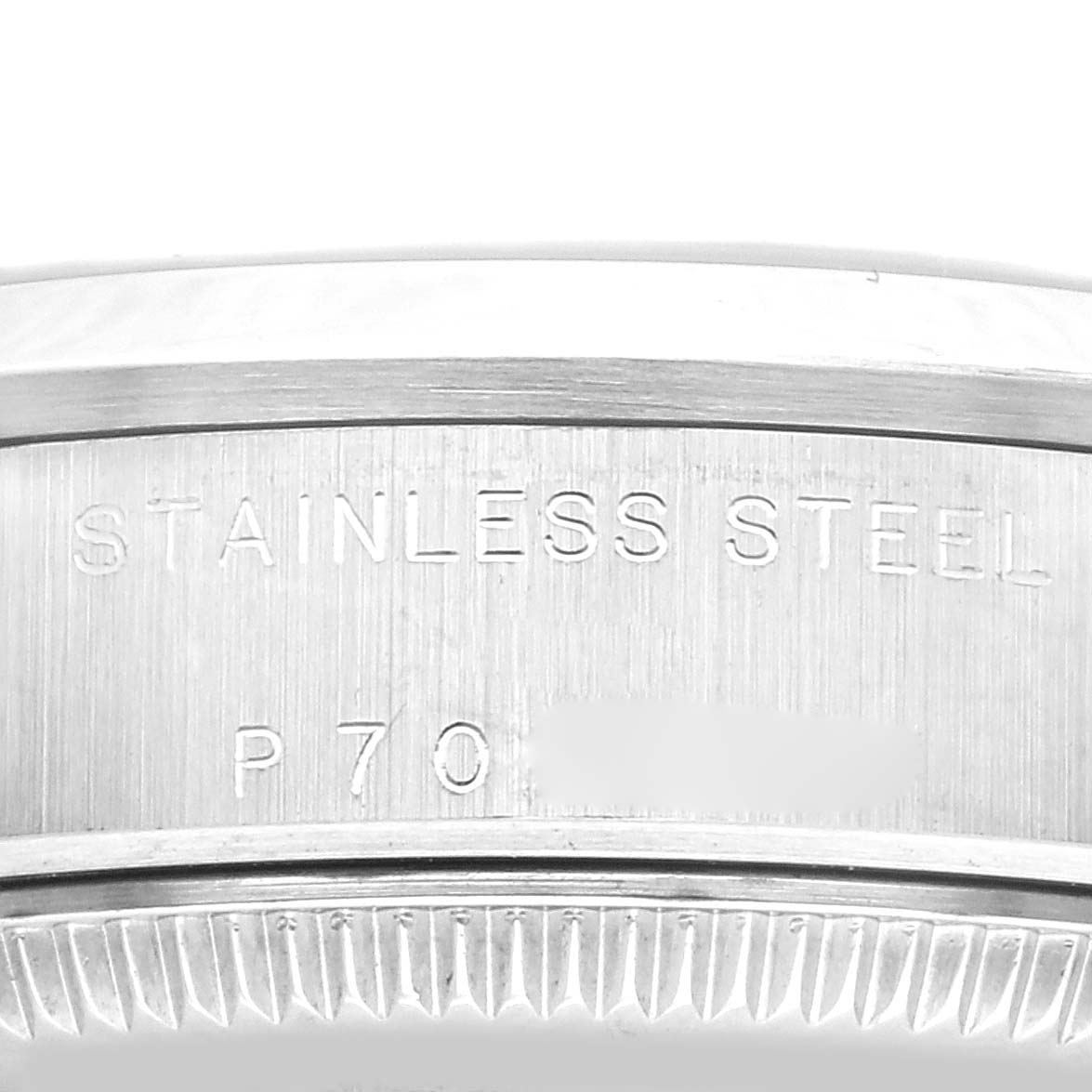 This close-up image shows the engraved text "STAINLESS STEEL" on the inner bezel of a Rolex Datejust 78240 Women's Stainless Steel Pink Dial 78240 Women's Stainless Steel Pink Dial watch.