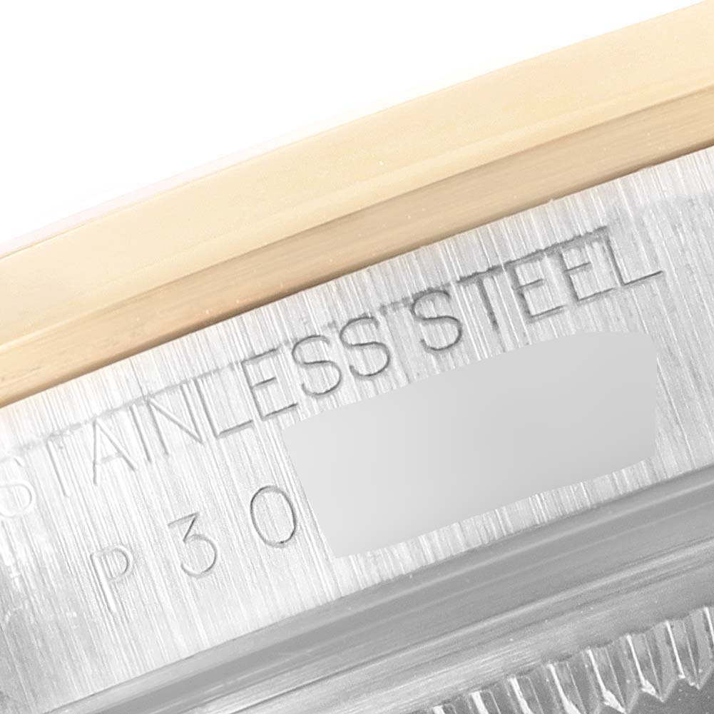 The image shows a close-up of the case back and engraving on a Rolex Datejust 16203 Men
s Steel and Gold (two tone) Grey Dial 16203 Men
s Steel and Gold (two tone) Grey Dial watch.