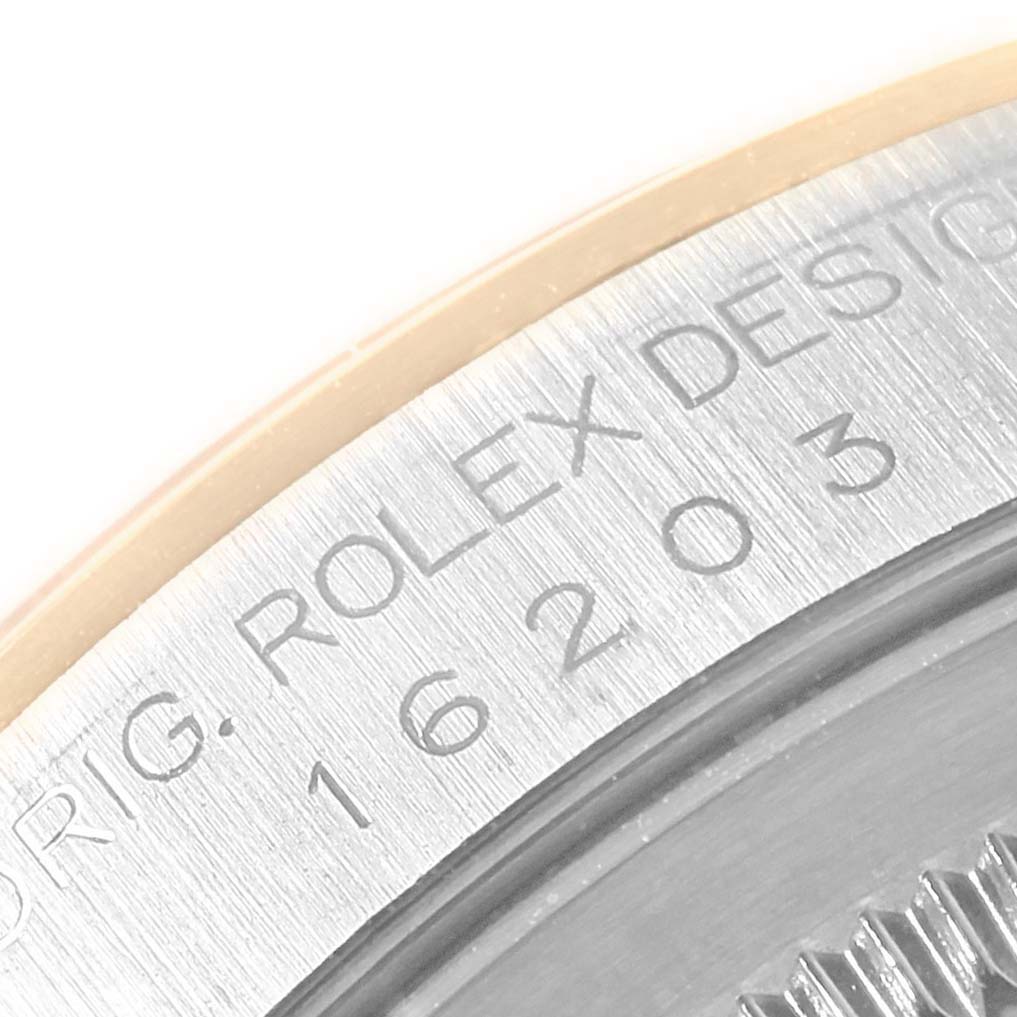 Close-up view of the side engraving and outer edge of a Rolex Datejust 16203 Men
s Steel and Gold (two tone) Grey Dial 16203 Men
s Steel and Gold (two tone) Grey Dial model.