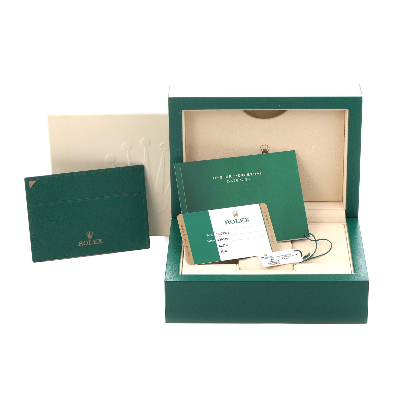 The image shows accessories of the Rolex Datejust 41 126334 Men's Stainless Steel Blue Dial 126334 Men's Stainless Steel Blue Dial, including its box, cardholder, manual, and tags.