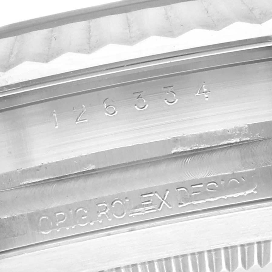 The image shows a close-up of the serial number and engraving on the case of a Rolex Datejust 41 126334 Men's Stainless Steel Blue Dial 126334 Men's Stainless Steel Blue Dial.