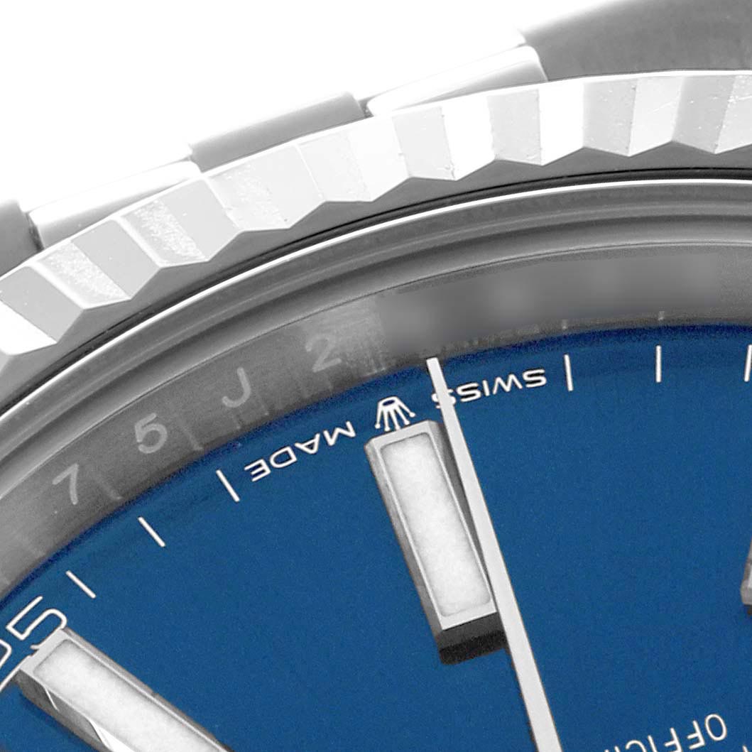 The image shows a partial view of the Rolex Datejust 41 126334 Men's Stainless Steel Blue Dial 126334 Men's Stainless Steel Blue Dial, featuring the bezel, a section of the blue dial, and hour markers.
