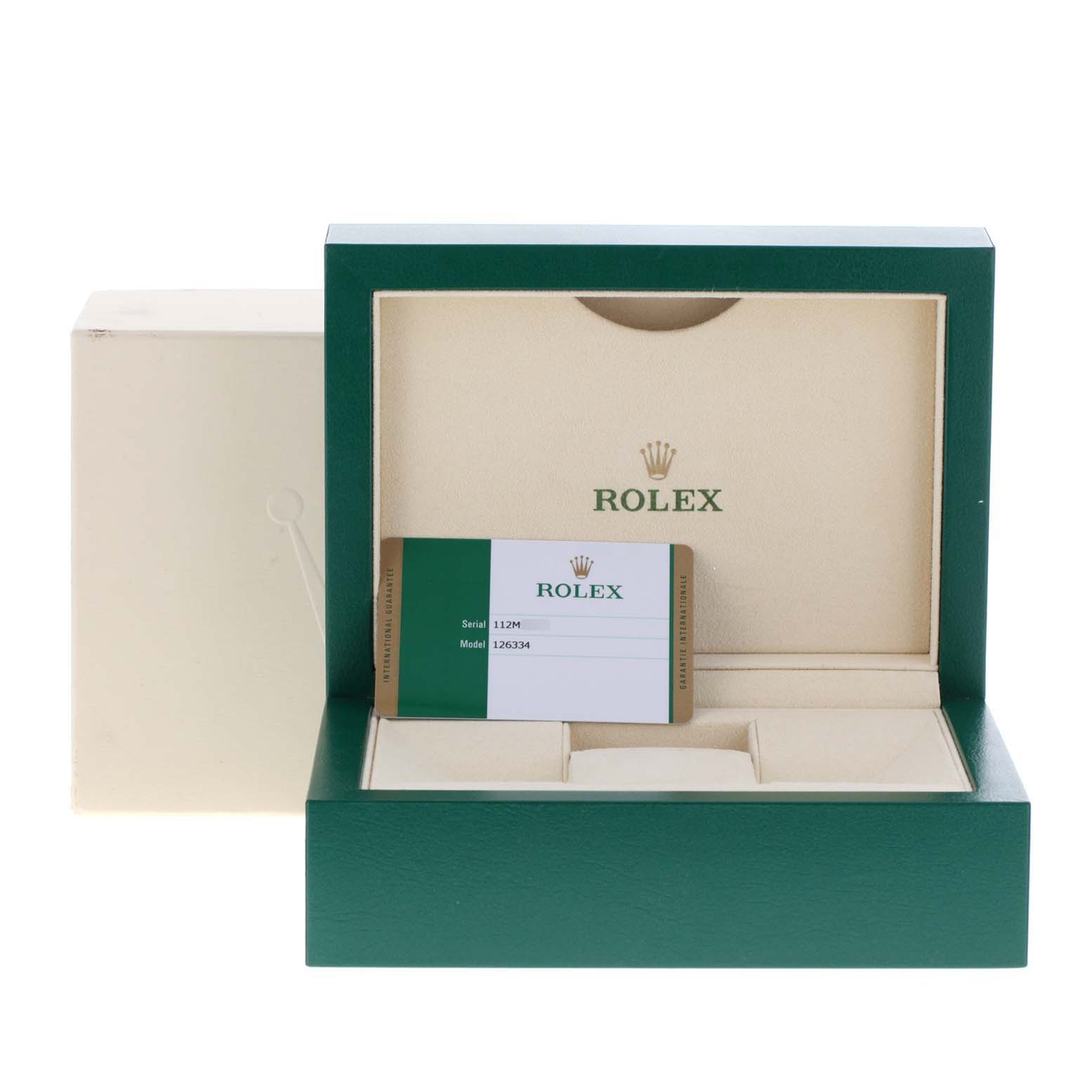 The image shows an open green box and card for the Rolex Datejust 41 126334 Men
s Stainless Steel White Dial 126334 Men
s Stainless Steel White Dial model, with its interior visible.