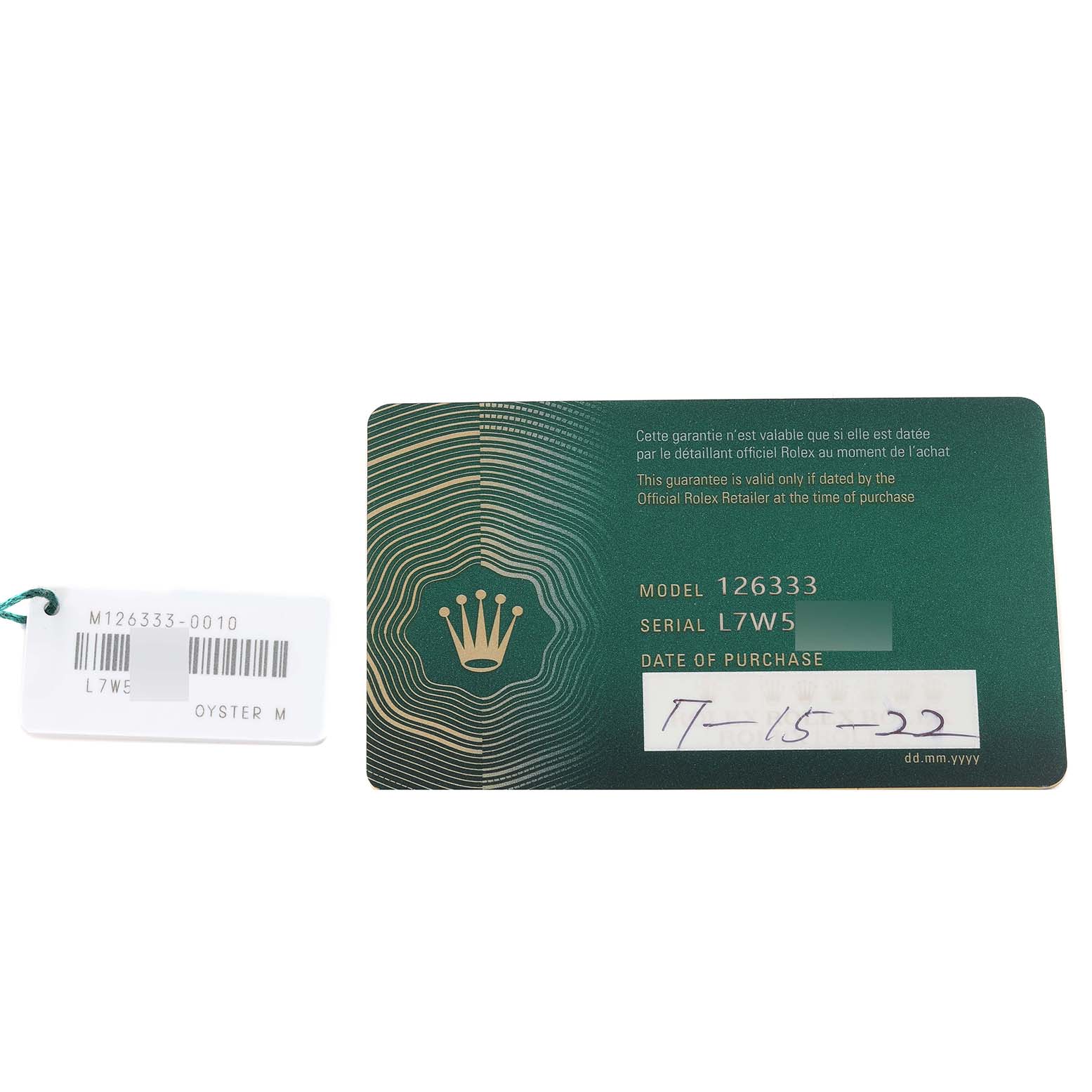 This image shows a guarantee card and tag for the Rolex Datejust 41 126333 Men's Steel and Gold (two tone) Champagne Dial 126333 Men's Steel and Gold (two tone) Champagne Dial model.