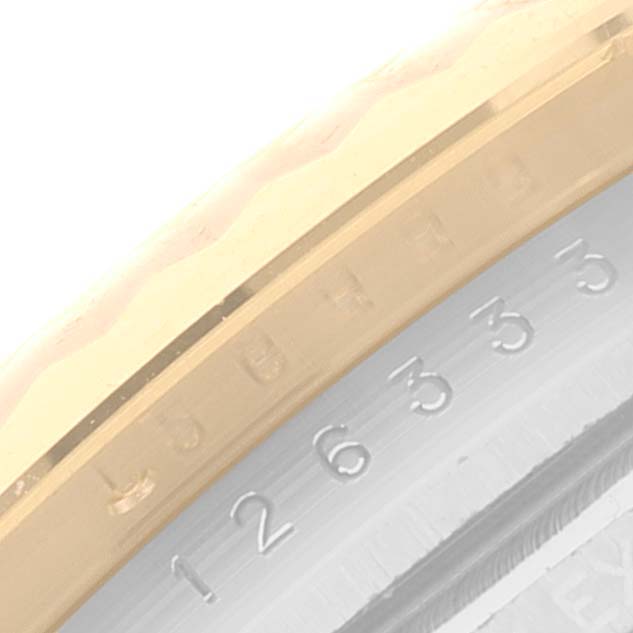 This is a close-up angled view of the bezel and outer edge of the dial from a Rolex Datejust 41 126333 Men's Steel and Gold (two tone) Champagne Dial 126333 Men's Steel and Gold (two tone) Champagne Dial watch.