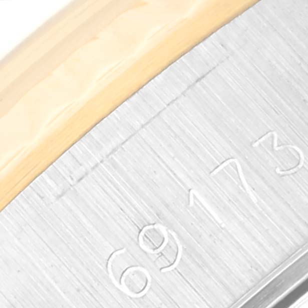 The image shows a close-up of the side view of a Rolex Datejust 69173 Women's Steel and Gold (two tone) Champagne Dial 69173 Women's Steel and Gold (two tone) Champagne Dial watch case, highlighting the model number 69173 and the bezel.