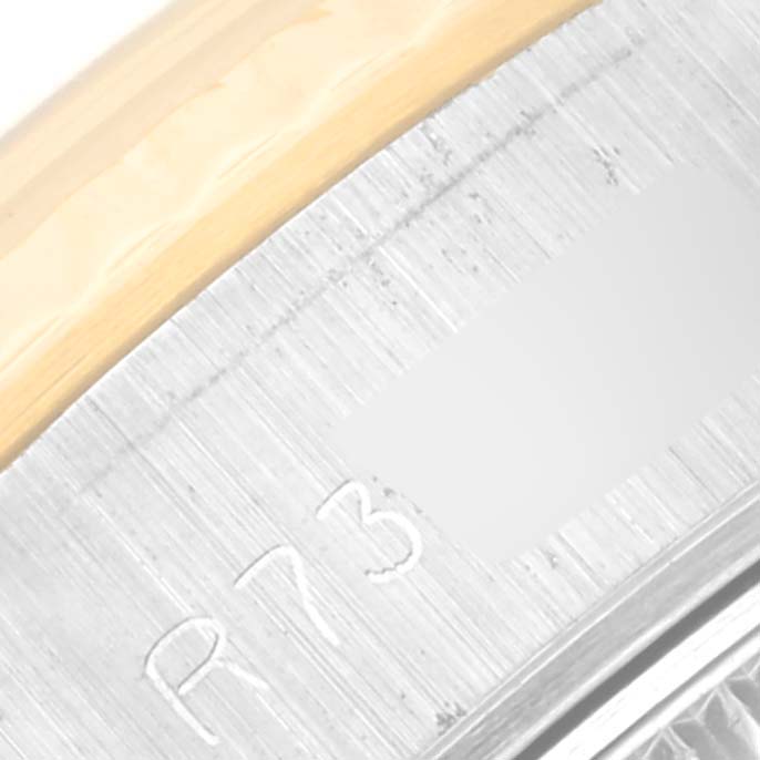 The image shows a close-up of the engraved serial number area on the case of a Rolex Datejust 69173 Women's Steel and Gold (two tone) Champagne Dial 69173 Women's Steel and Gold (two tone) Champagne Dial watch.