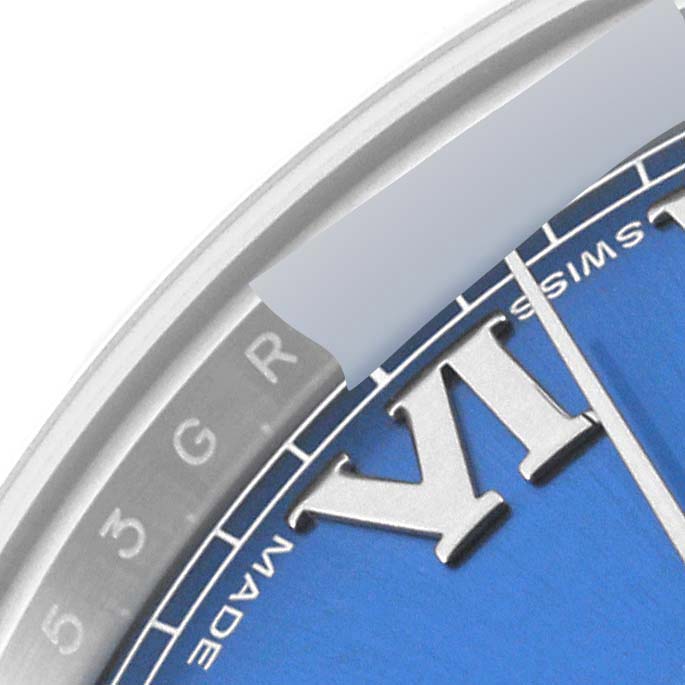 This close-up image shows part of the blue dial and Roman numeral markers of the Rolex Datejust 41 116334 Men's Stainless Steel Blue Dial 116334 Men's Stainless Steel Blue Dial watch.