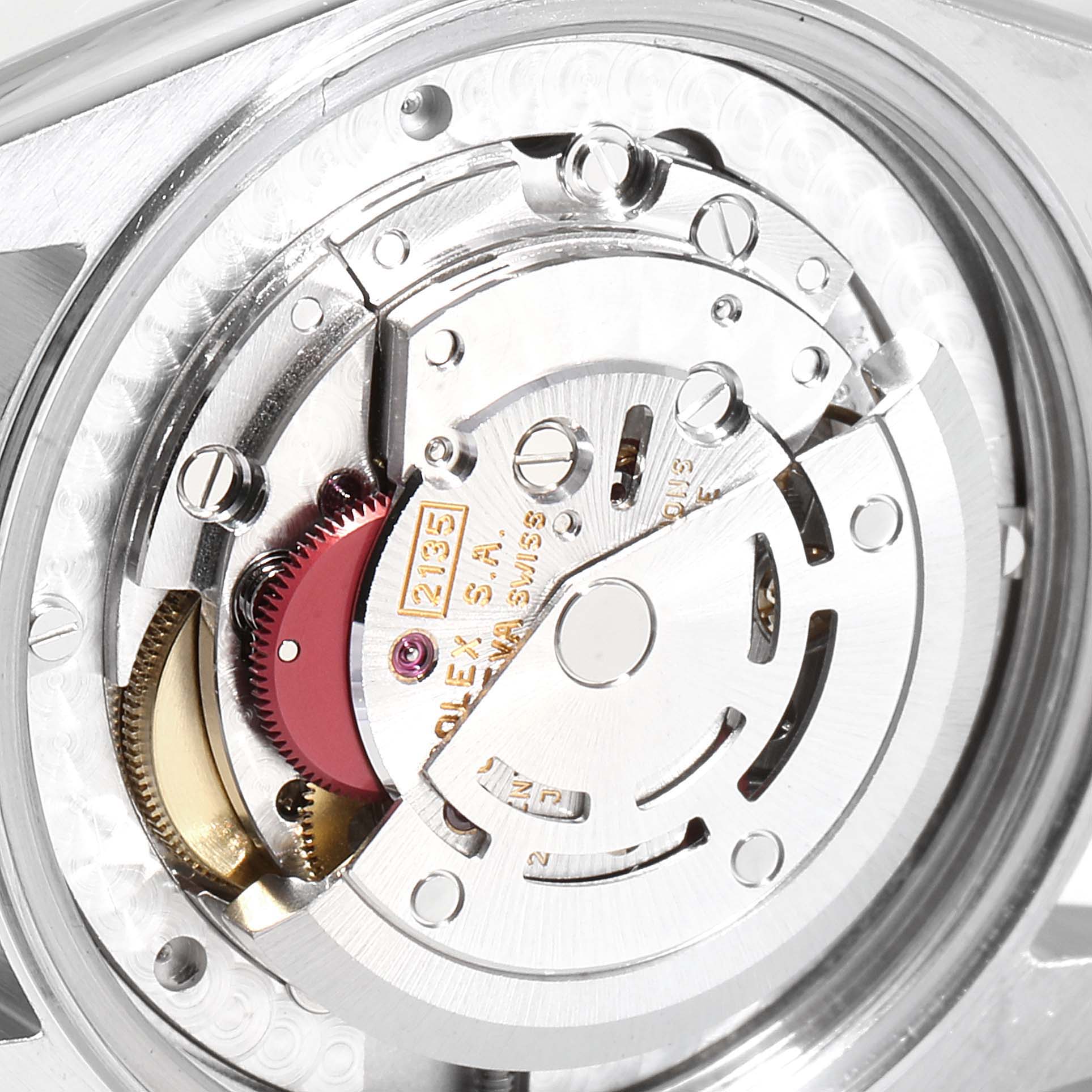 This image shows a close-up view of the movement mechanism inside a Mid-Size Rolex watch.