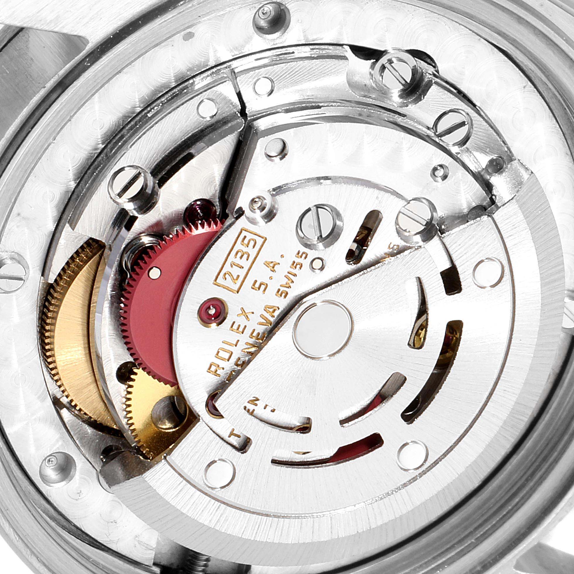 This image shows the internal mechanism of a mid-size Rolex watch, capturing gears and the rotor at an angled close-up view.