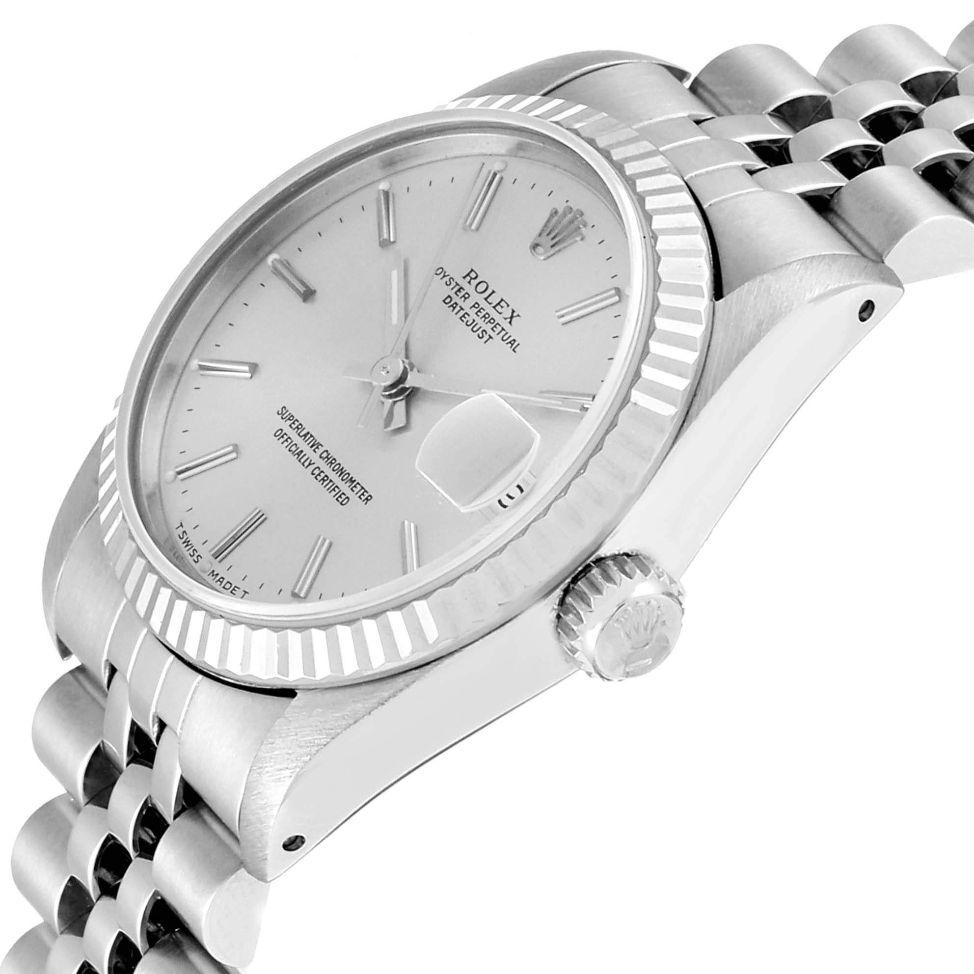 The image shows a Rolex Mid-Size 68274 Women
s Stainless Steel Silver Dial 68274 Women
s Stainless Steel Silver Dial watch displaying its dial, bezel, crown, and part of the bracelet, viewed from an angled side perspective.