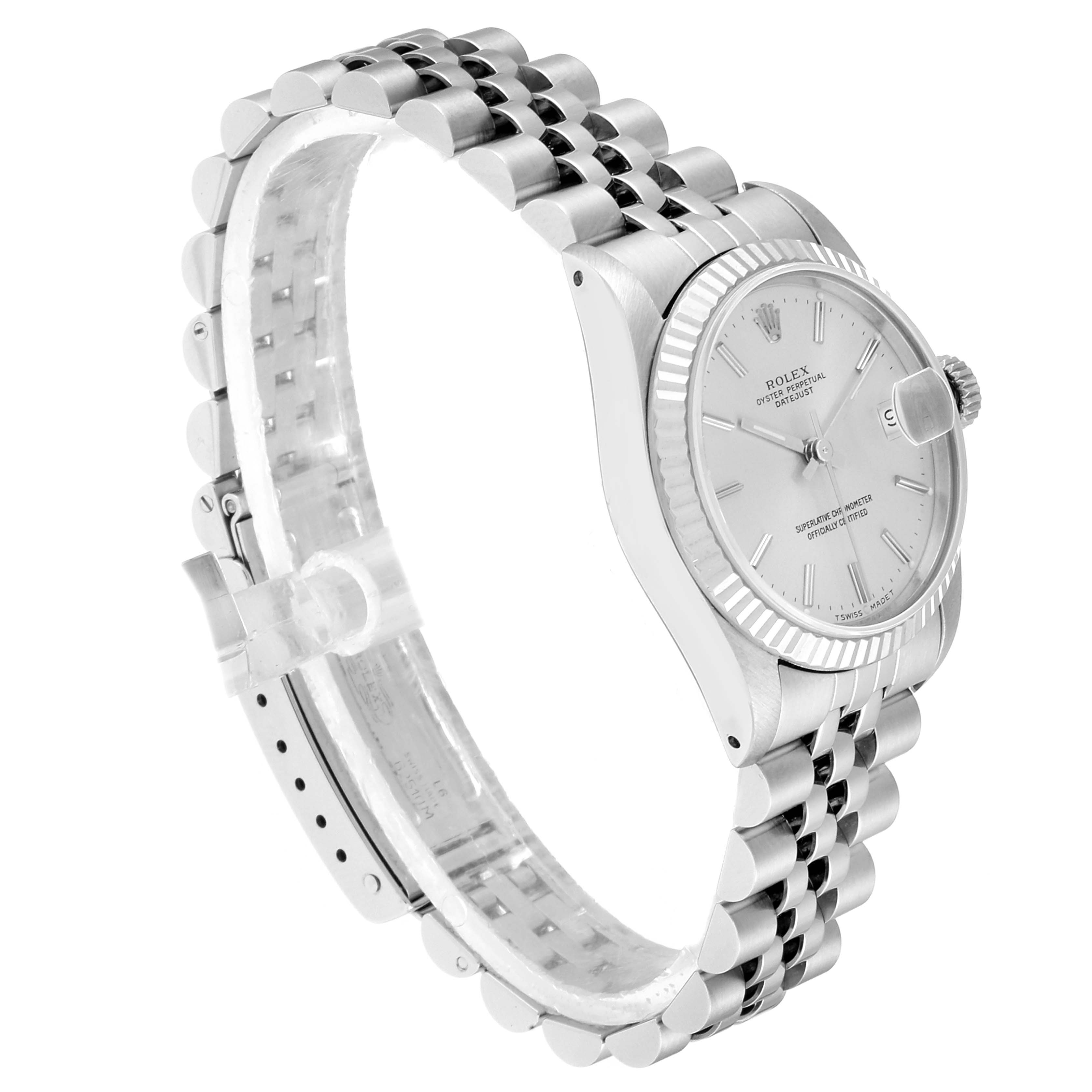 The image shows a Rolex Mid-Size 68274 Women
s Stainless Steel Silver Dial 68274 Women
s Stainless Steel Silver Dial model watch at a side angle, highlighting the face, crown, and stainless steel bracelet.