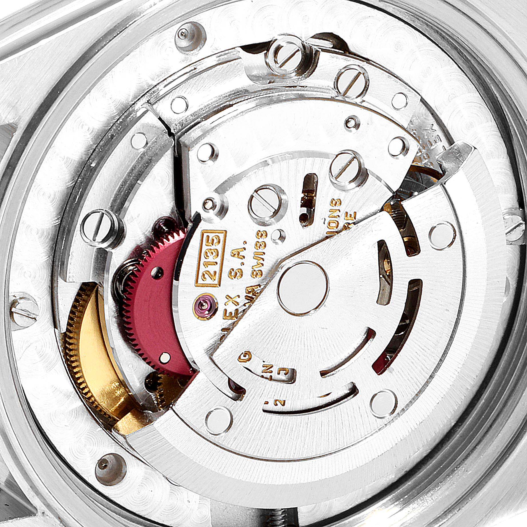 This image shows a close-up of the movement mechanism inside a Mid-Size Rolex watch, highlighting gears and internal components.