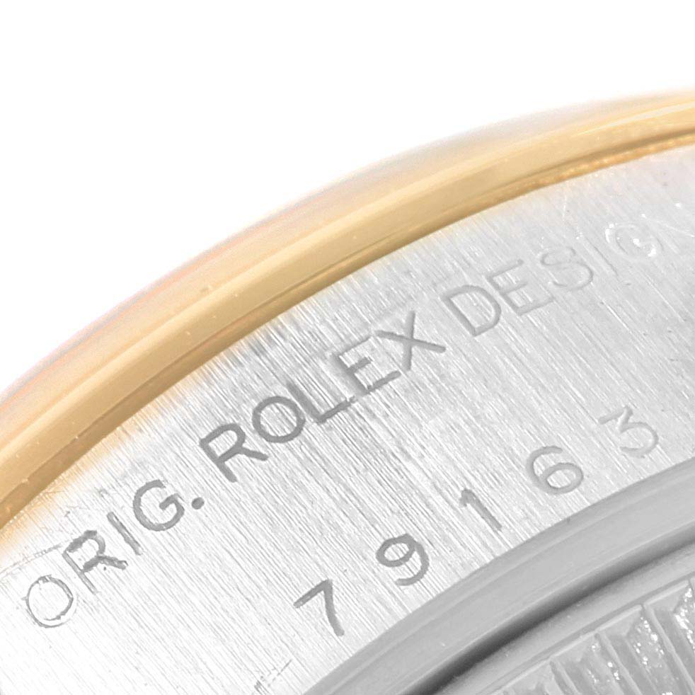 The image shows a close-up of the engraved case back of a Rolex Datejust 79163 Women's Steel and Gold (two tone) Silver Dial 79163 Women's Steel and Gold (two tone) Silver Dial watch.