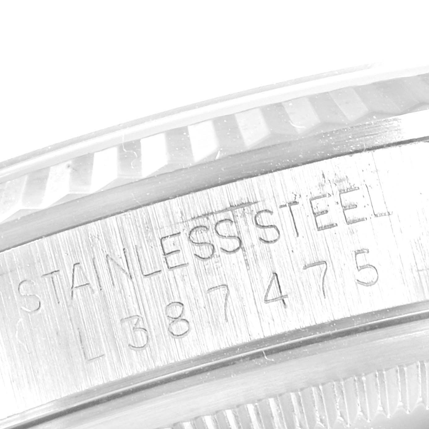 The image zooms in on the side of a Rolex Datejust 16234 Men's Stainless Steel Silver Dial 16234 Men's Stainless Steel Silver Dial, focusing on the stainless steel case and engraved serial number.