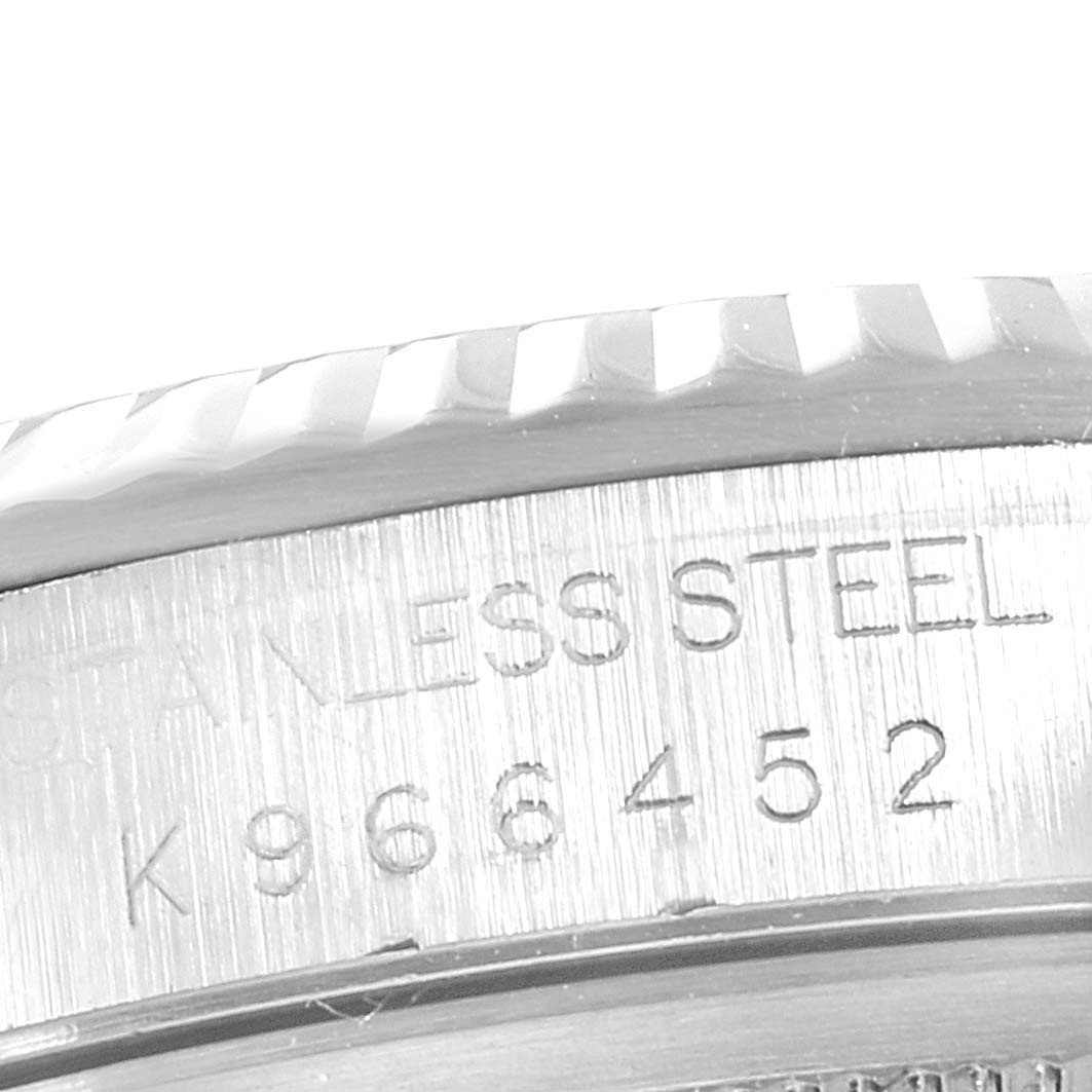 This image shows a macro view of the case and serial number engraving on a Rolex Datejust 16234 Men's Stainless Steel Silver Dial 16234 Men's Stainless Steel Silver Dial model.