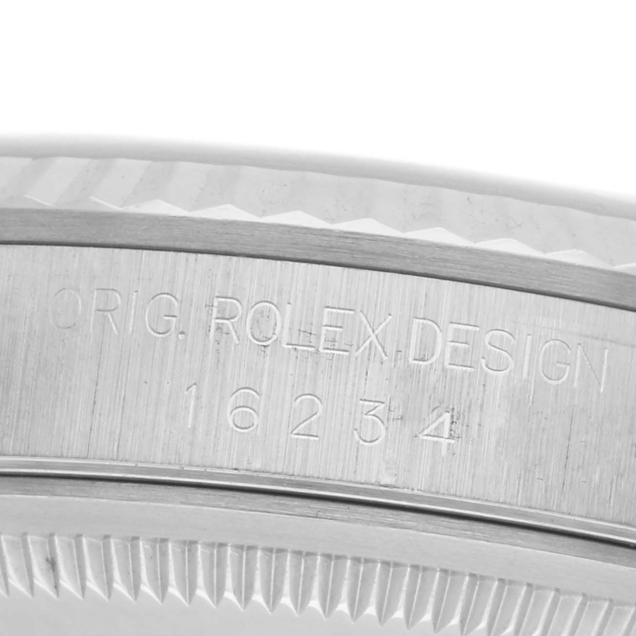The image shows the side profile of a Rolex Datejust 16234 Men's Stainless Steel Silver Dial 16234 Men's Stainless Steel Silver Dial watch, focusing on the engraved case and bezel edge details.