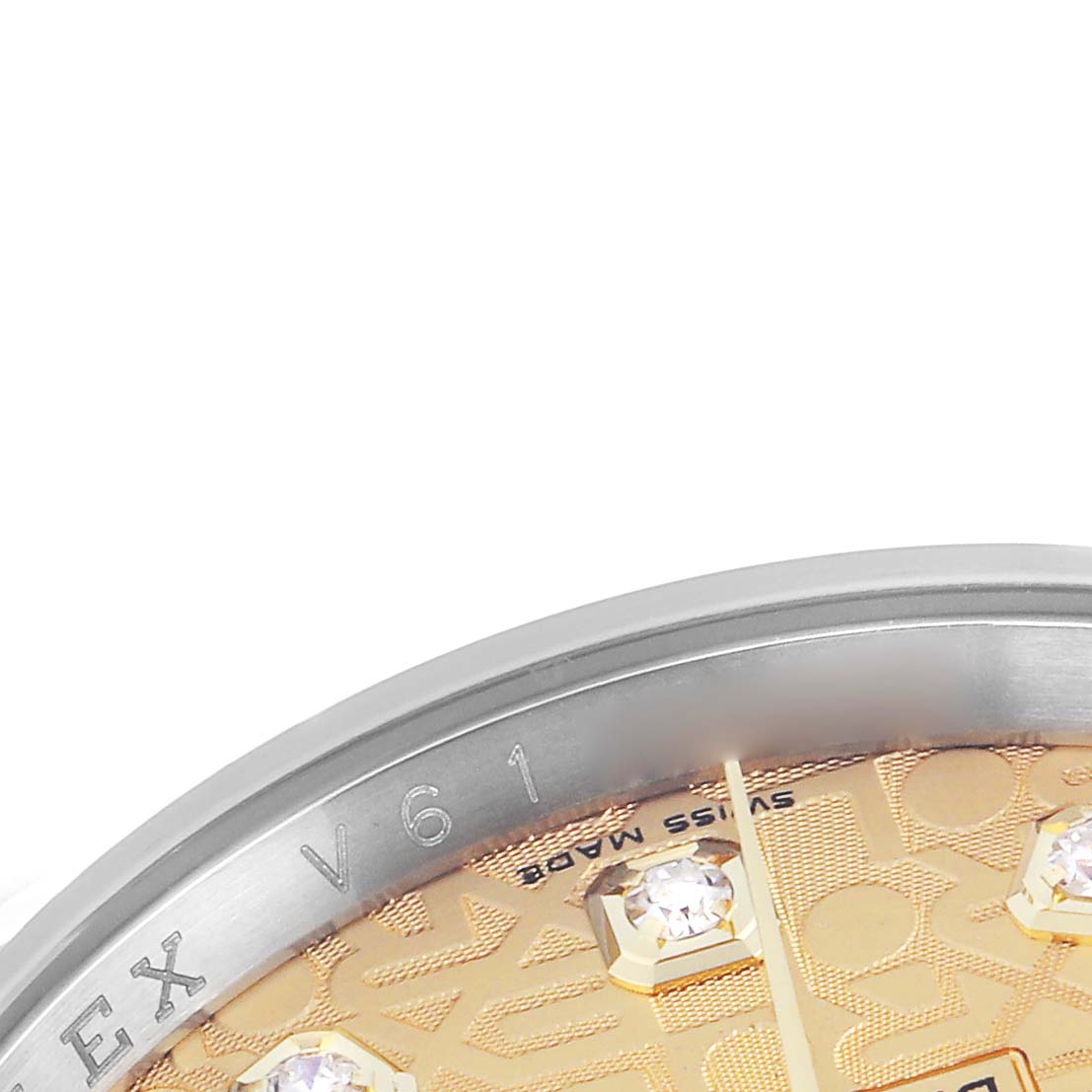 The image shows a close-up of the bezel and dial of a Rolex Datejust 116233 Men's Steel and Gold (two tone) Champagne Dial 116233 Men's Steel and Gold (two tone) Champagne Dial, displaying part of the face and diamond hour markers.