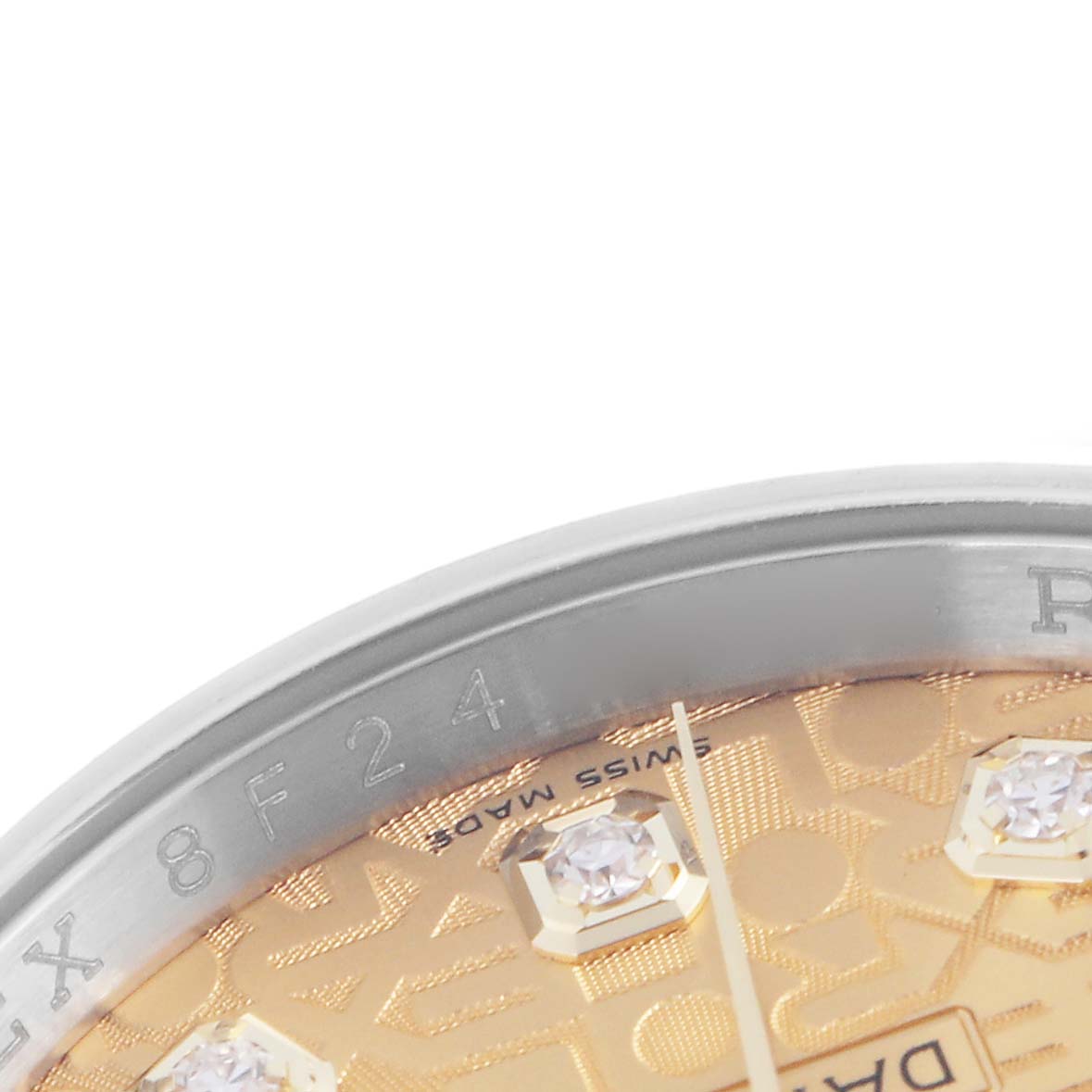 The image shows a close-up of the dial and bezel of a Rolex Datejust 116233 Men's Steel and Gold (two tone) Champagne Dial 116233 Men's Steel and Gold (two tone) Champagne Dial watch, highlighting the diamonds and engravings.