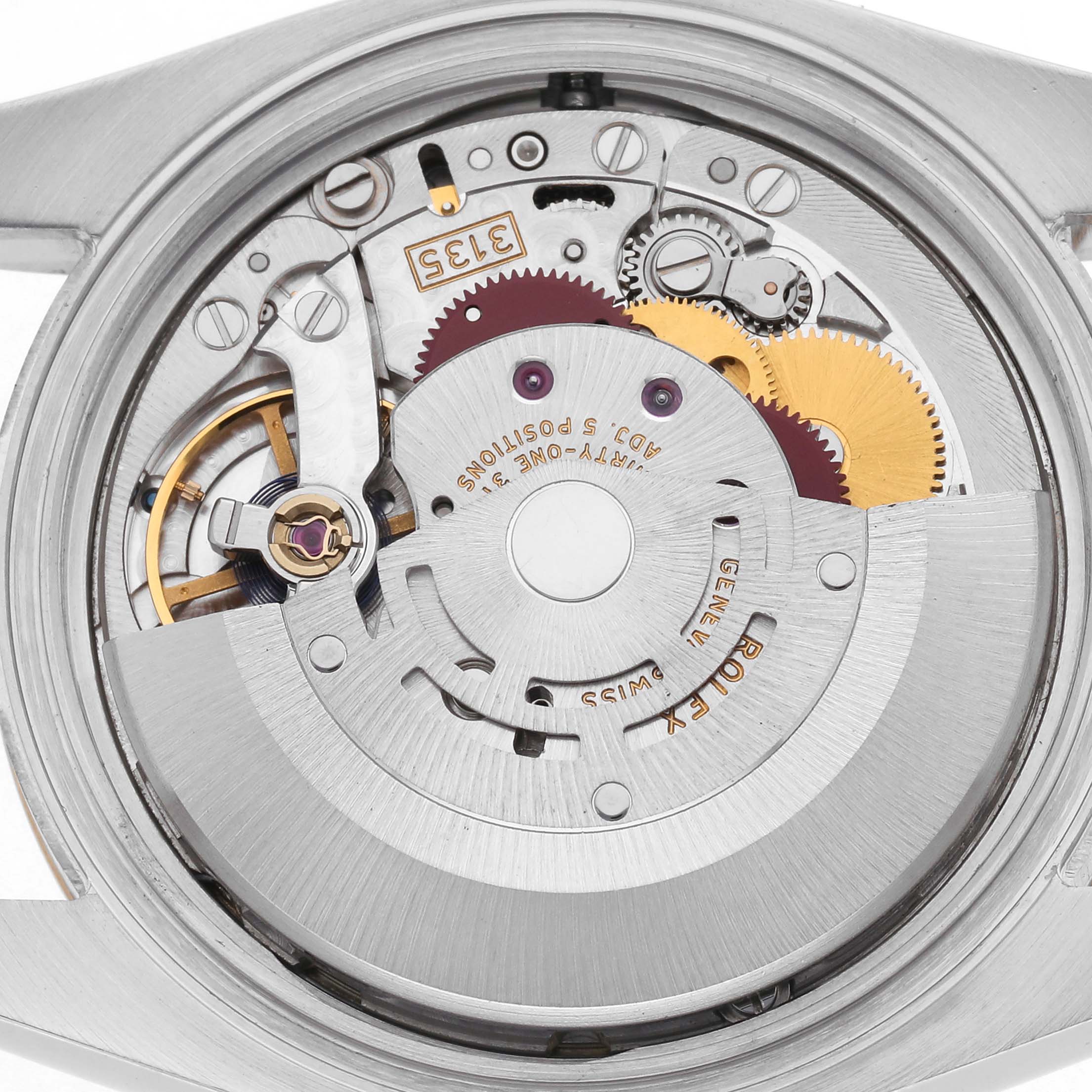 The image shows the movement of a Rolex Datejust 116233 Men's Steel and Gold (two tone) Champagne Dial 116233 Men's Steel and Gold (two tone) Champagne Dial watch from a back angle, highlighting the rotor and gears.